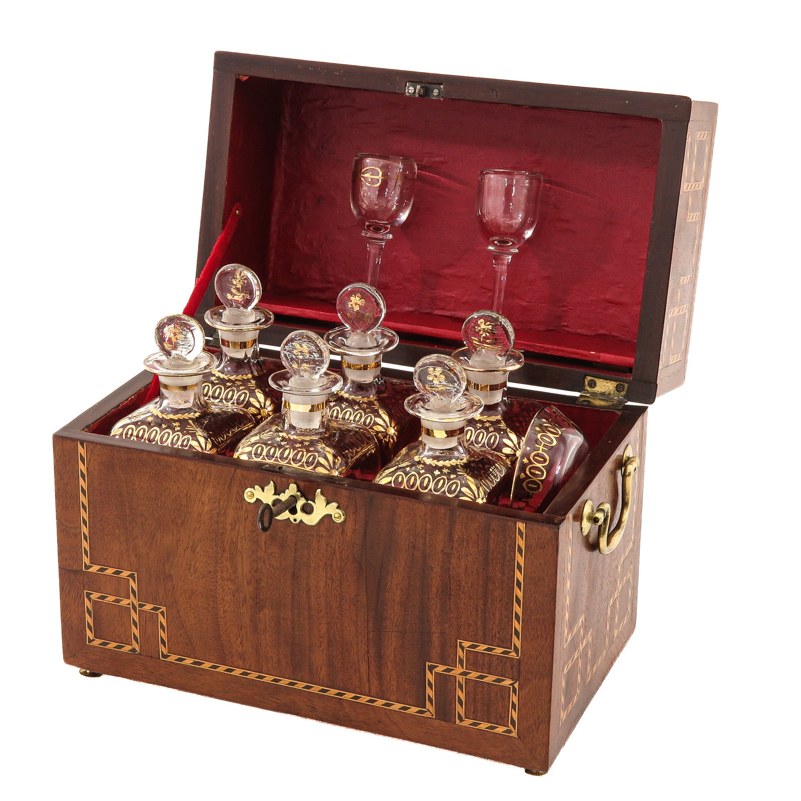 A Liqueur Cellar: 19th century, with inlaid wood and fitted interior, 6 decanters and 2 glasses, case 29 x 23 x 17 cm.