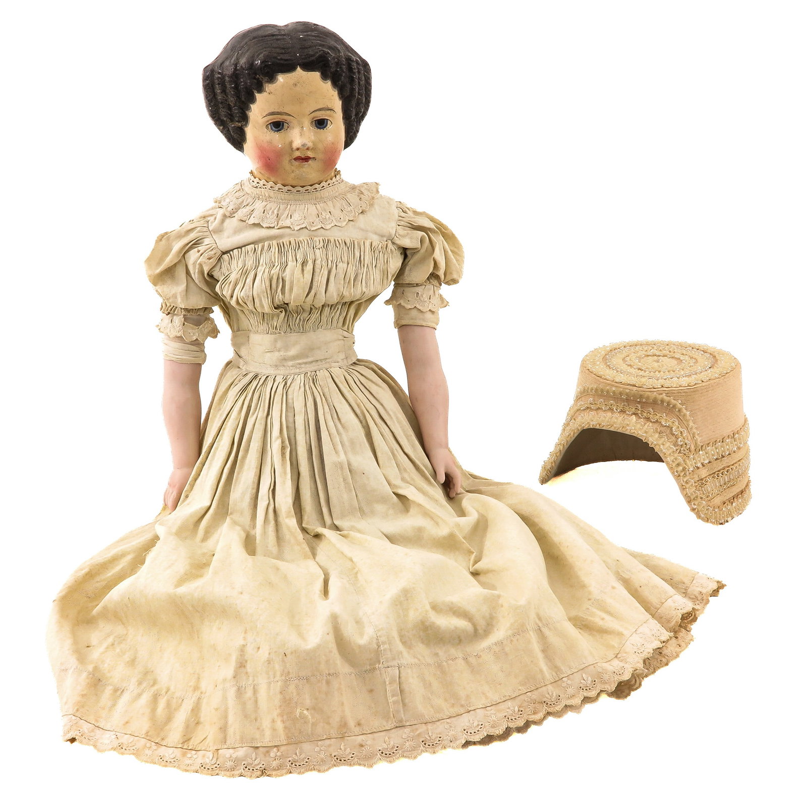An Antique Doll and Dutch Hat: consisting of a doll, 19th century, with a composite head, in original clothing and a bonnet, height doll 68 cm.