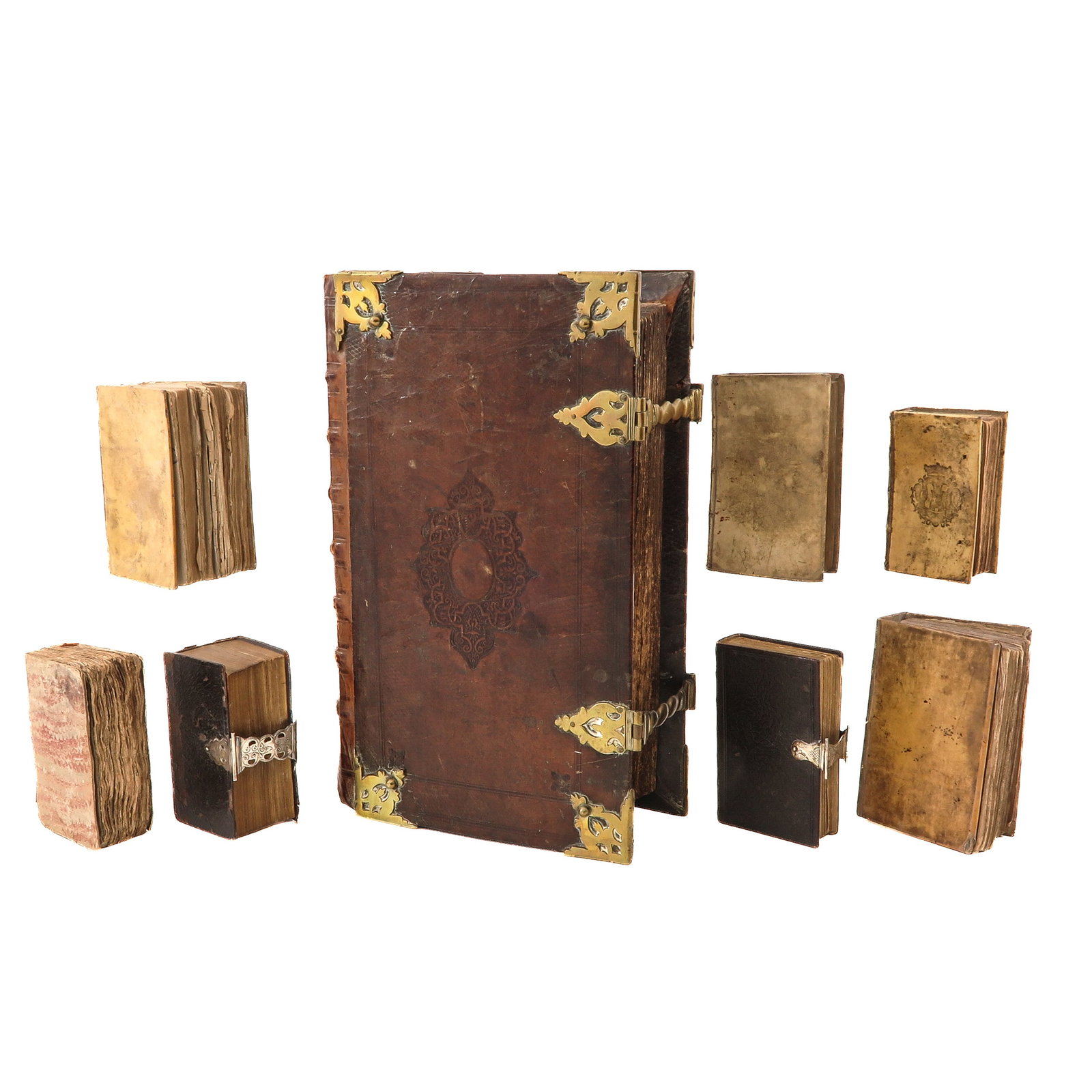 A Collection of Books: consisting of 8 books, including a States Bible, bound in leather with copper fittings and clasps, 28 x 45 x 13 cm.