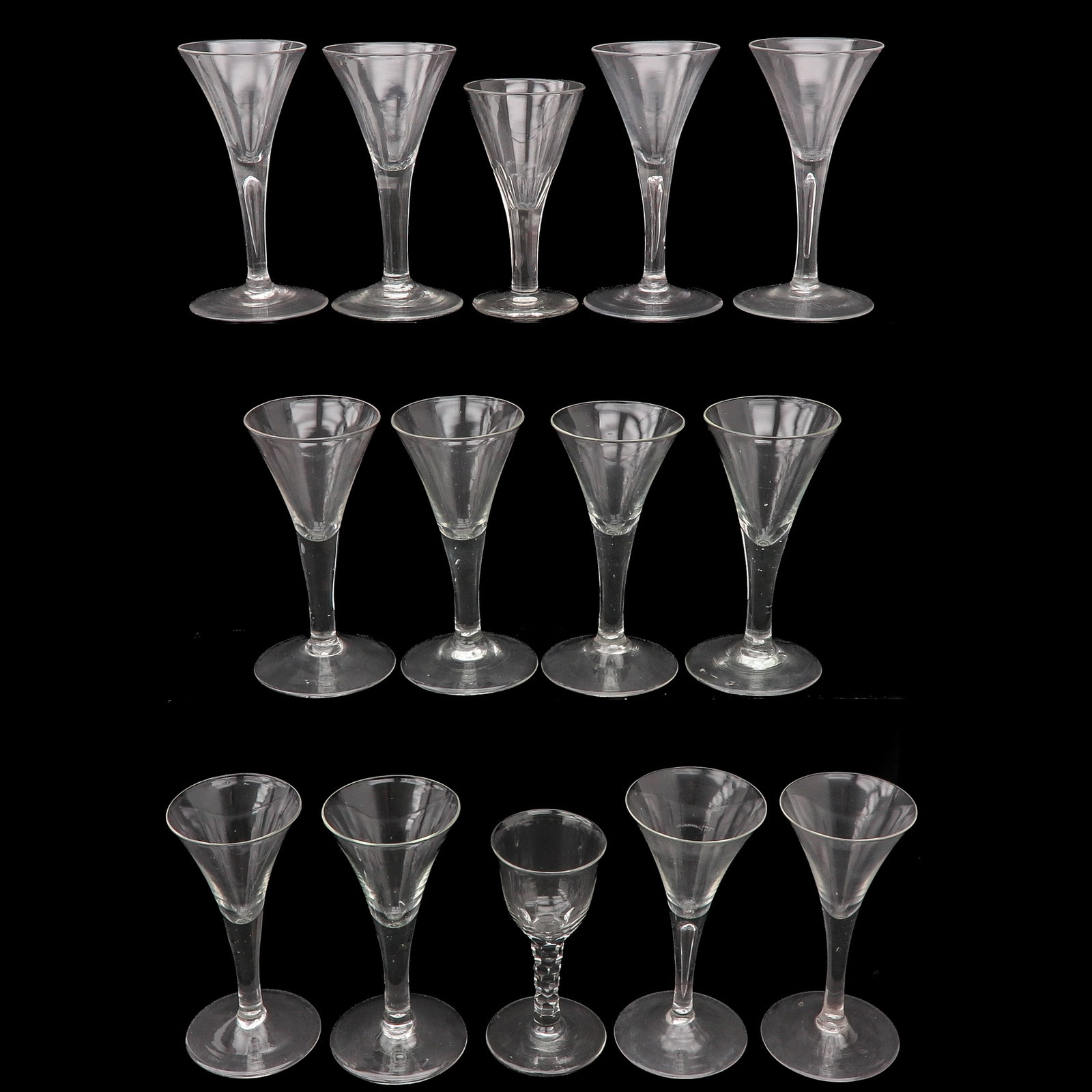 A Group of Glass Goblets: consisting of 14 goblets, of which 12 from the 18th century and 2 later examples, tallest 16 cm.