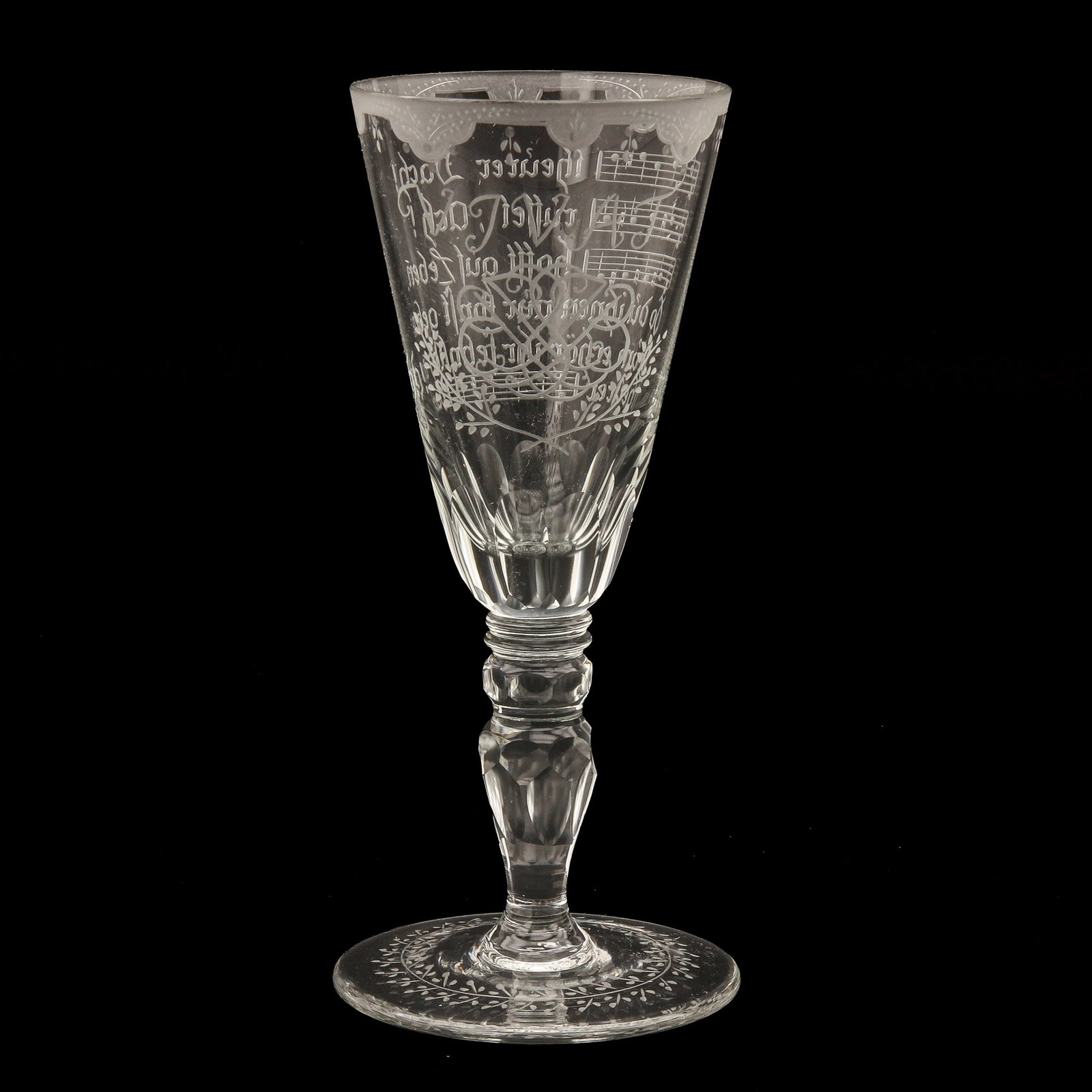 A 19th Century Goblet: 19th century, decorated with a detailed wheel engraving of sheet music, signed, height 20 cm.