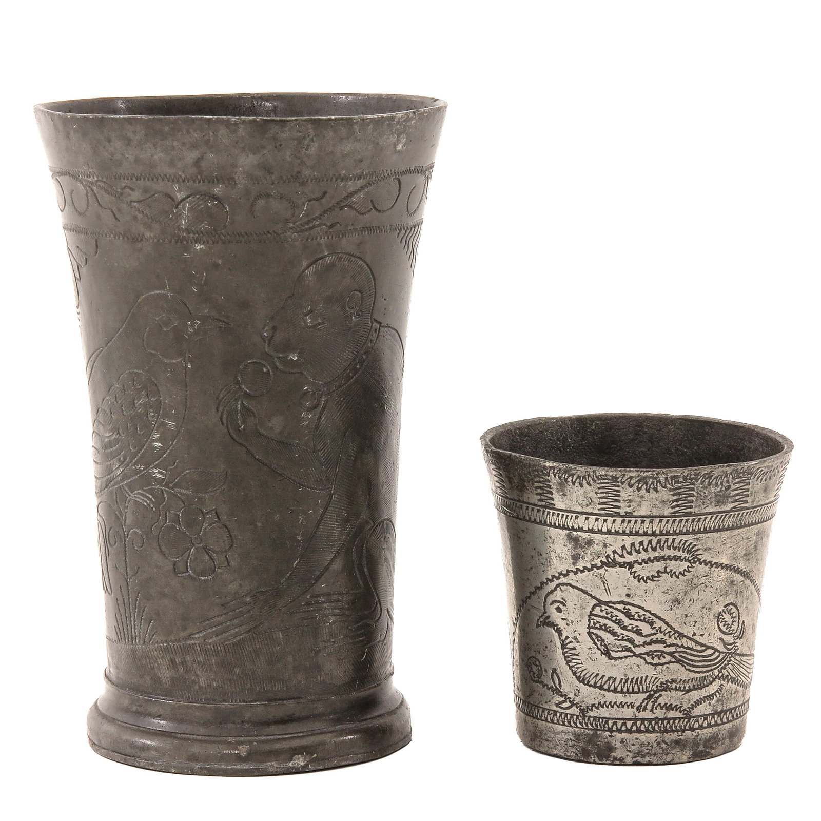 A Lot of 2 Pewter Beakers: consisting of 2 pewter beakers, including a 17th-century beaker, marked Gooswijn , Amsterdam, engraved with a monkey and a heron, height 14 cm., and a small beaker, ca. 1700, engraved with birds,