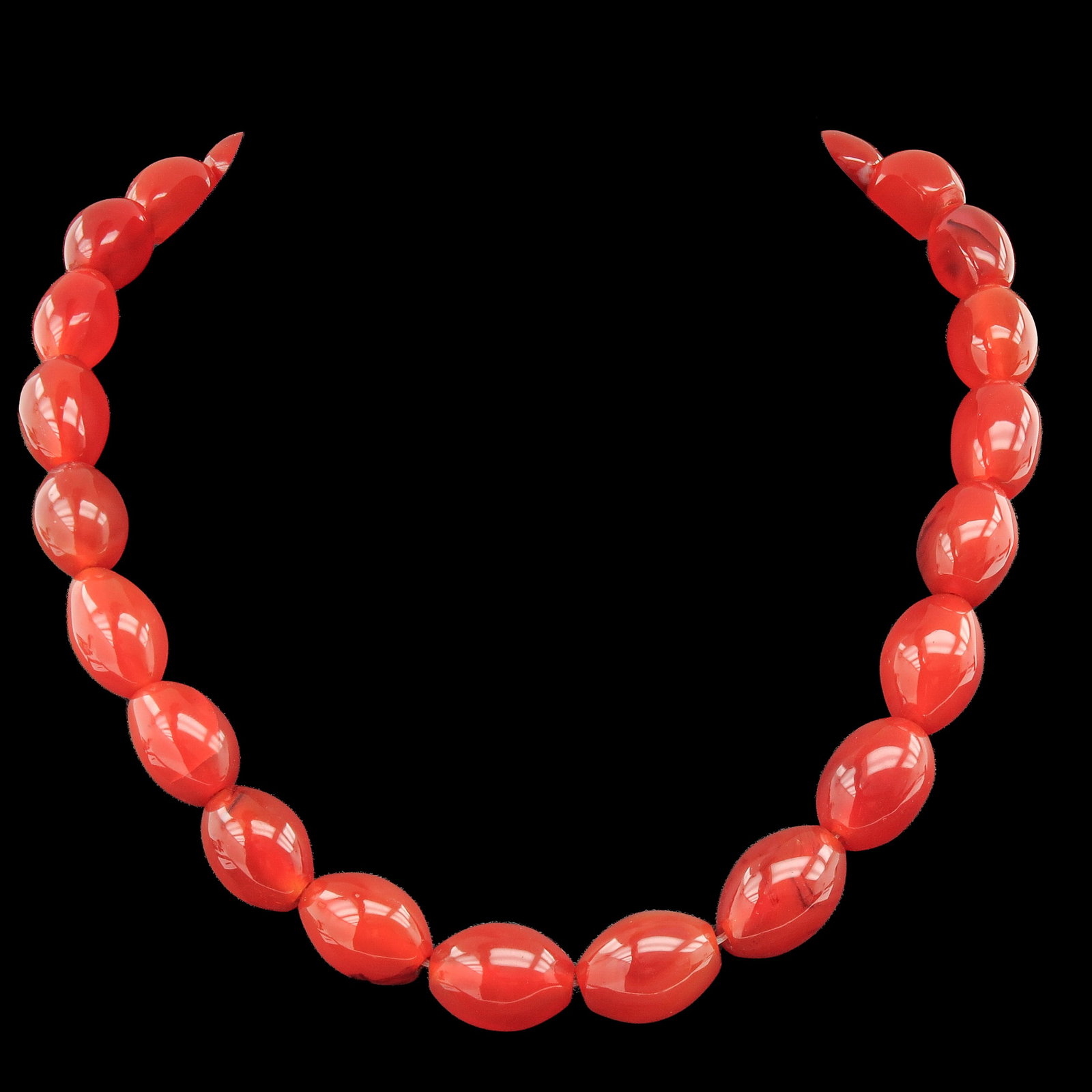A Carnelian Necklace: carnelian, with graduated beads, largest 15 x 20 mm., weight 97 grams
