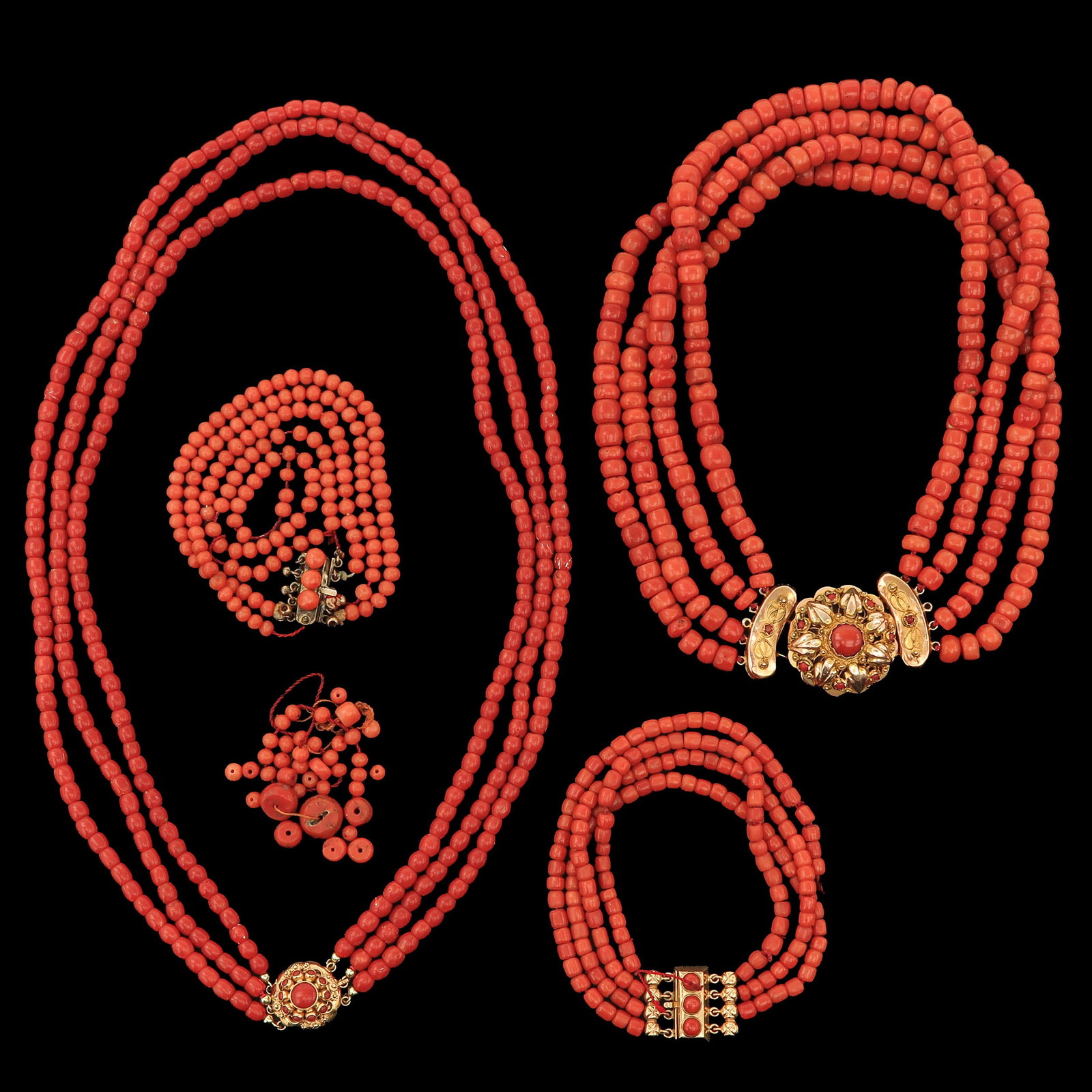 A Collection of Red Coral Jewelry: consisting of 2 necklaces, 2 bracelets and loose beads, largest diameter 8 mm., weight 248 grams, including 14 Krt. gold