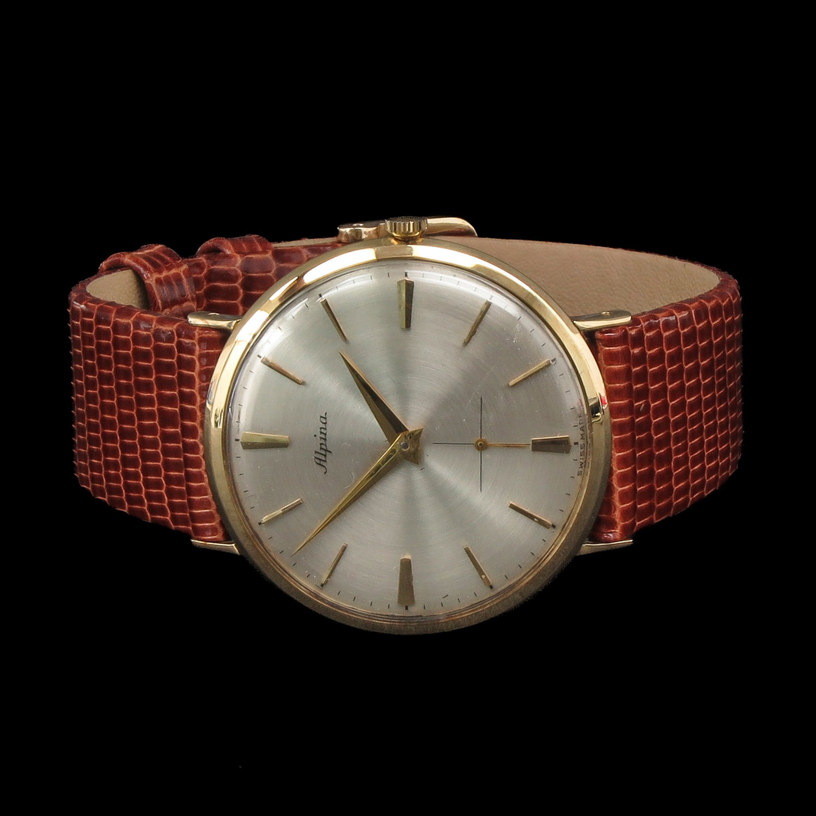 A Men's Alpina Watch: Alpina, 14 Krt. gold, in original box with papers, case diameter 33 mm.