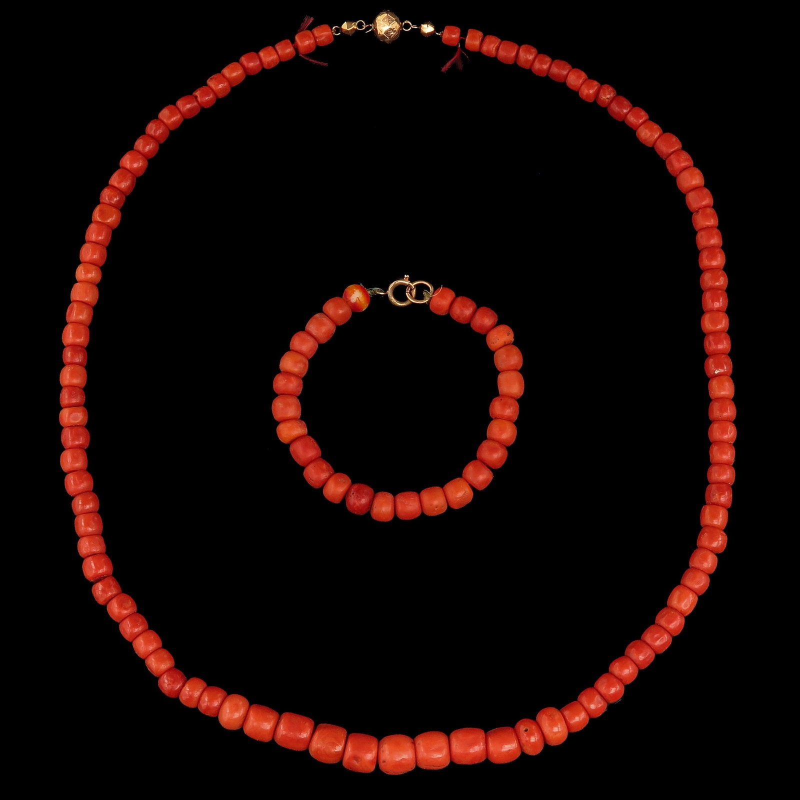 A Collection of Jewelry: consisting of necklace and bracelet of red coral, diameter beads 6 - 10 mm., weight 91 grams.