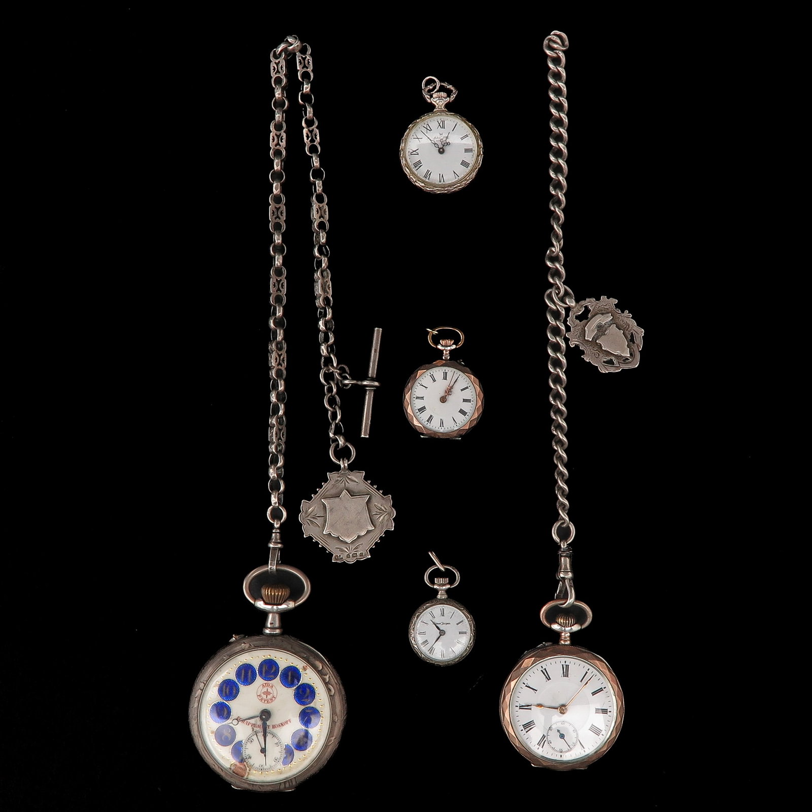 A Group of Pocket watches: consisting of various pocket watches, partly with chatelaine, largest case diameter 54 mm.