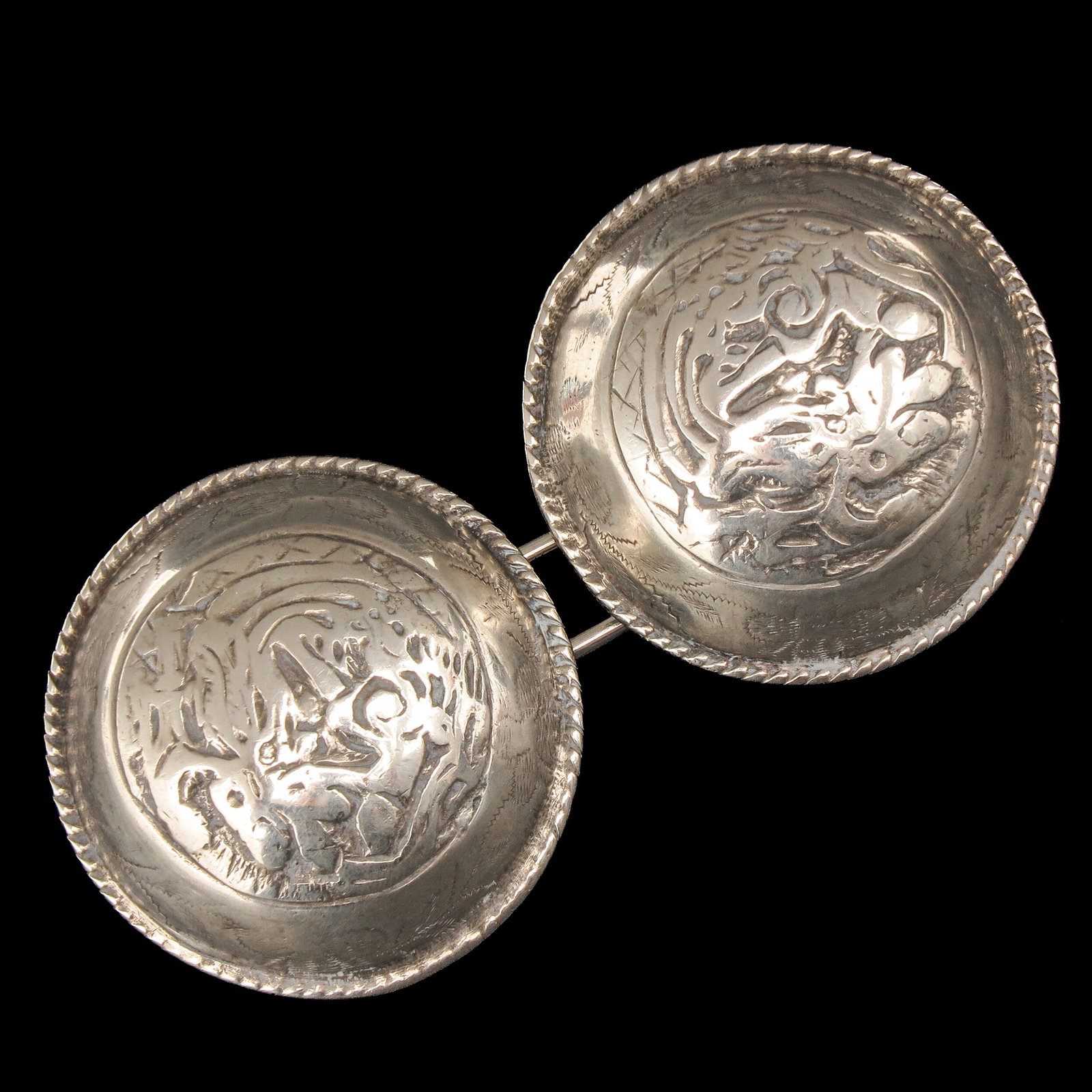 A Pair of Silver Broekstukken: silver breeches pieces, diameter 55 mm.