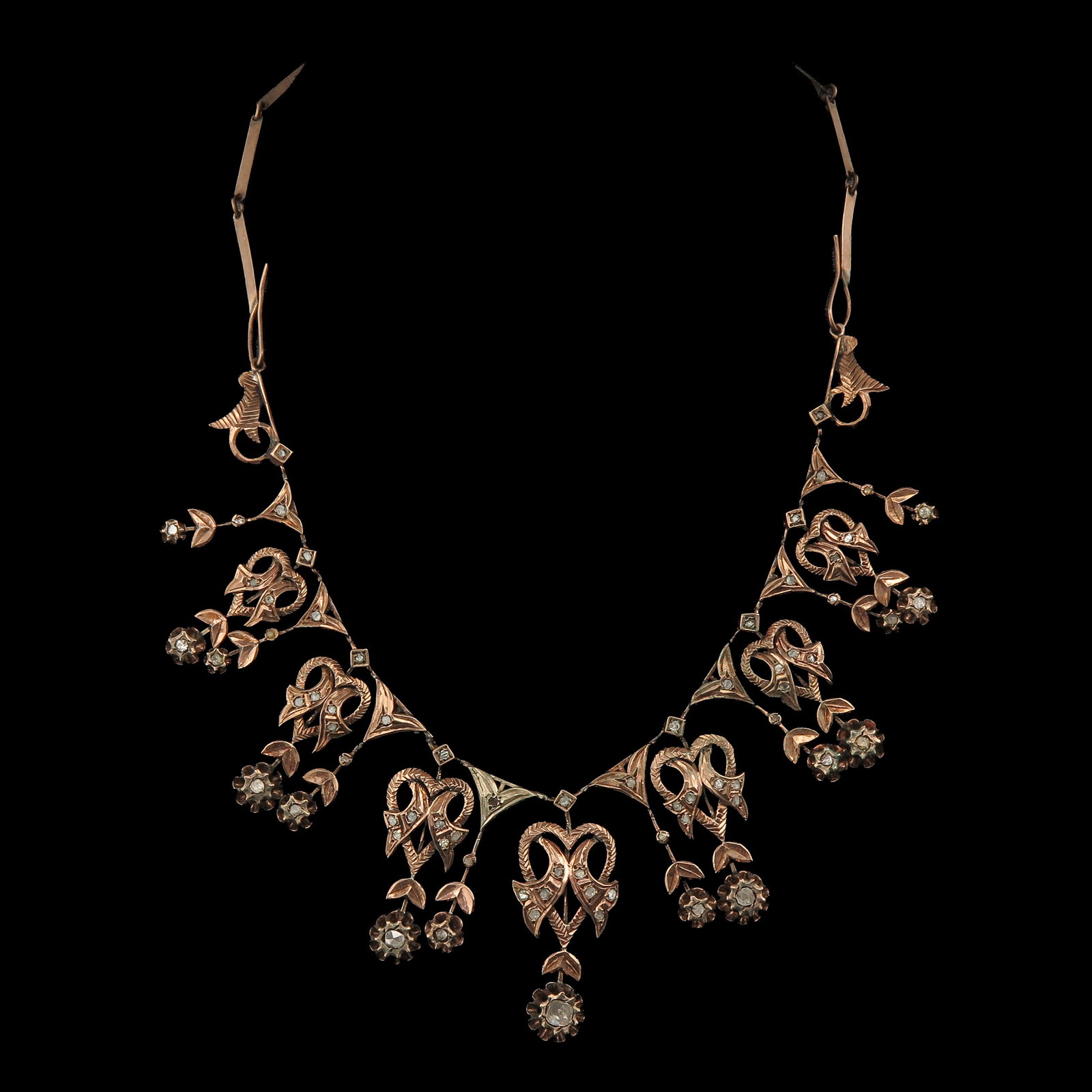 A 19th Century Necklace: 19th century, with floral and leaf motifs, set with diamonds, length 43 cm.