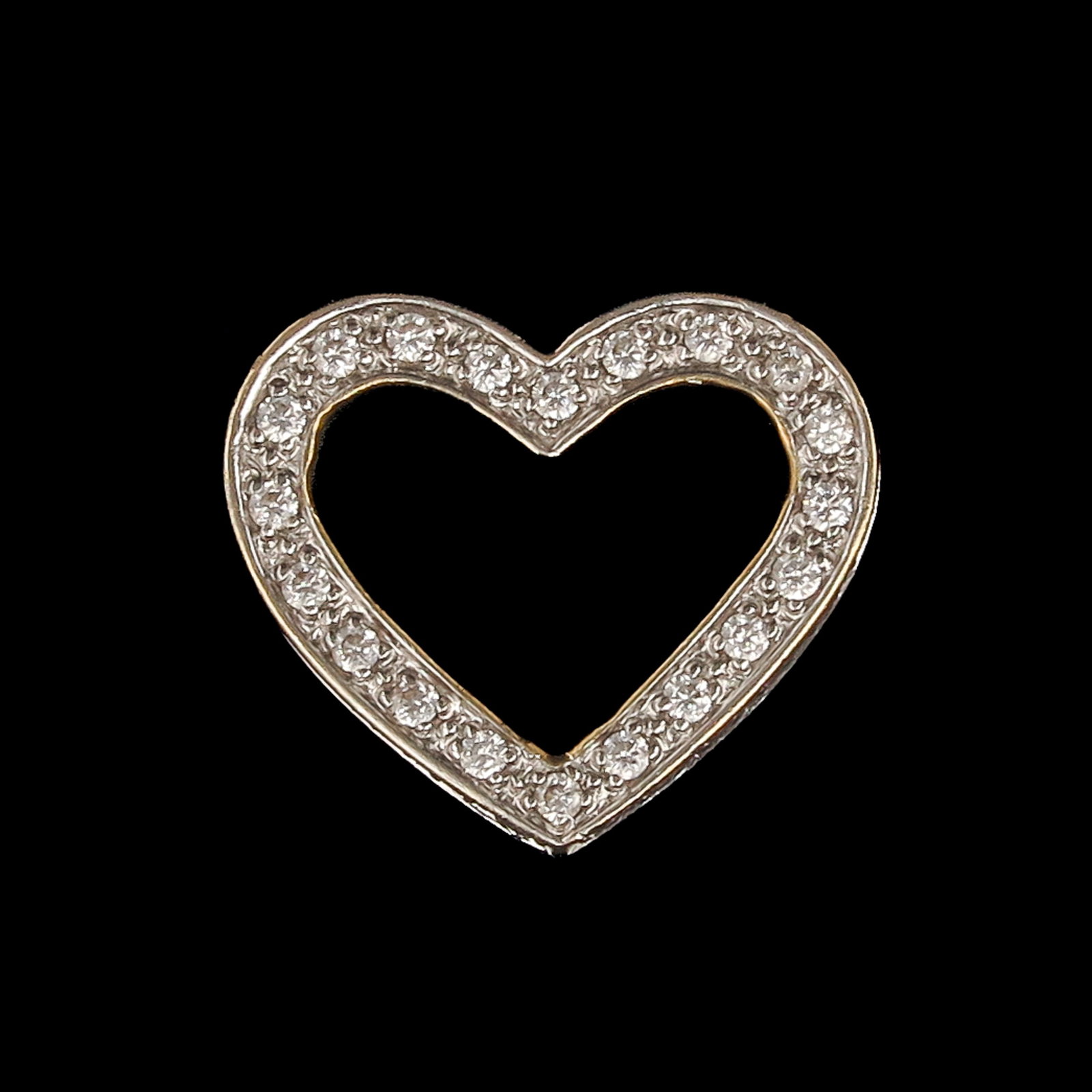 A Gold Pendant: gold, in the form of a heart, length 17 mm.