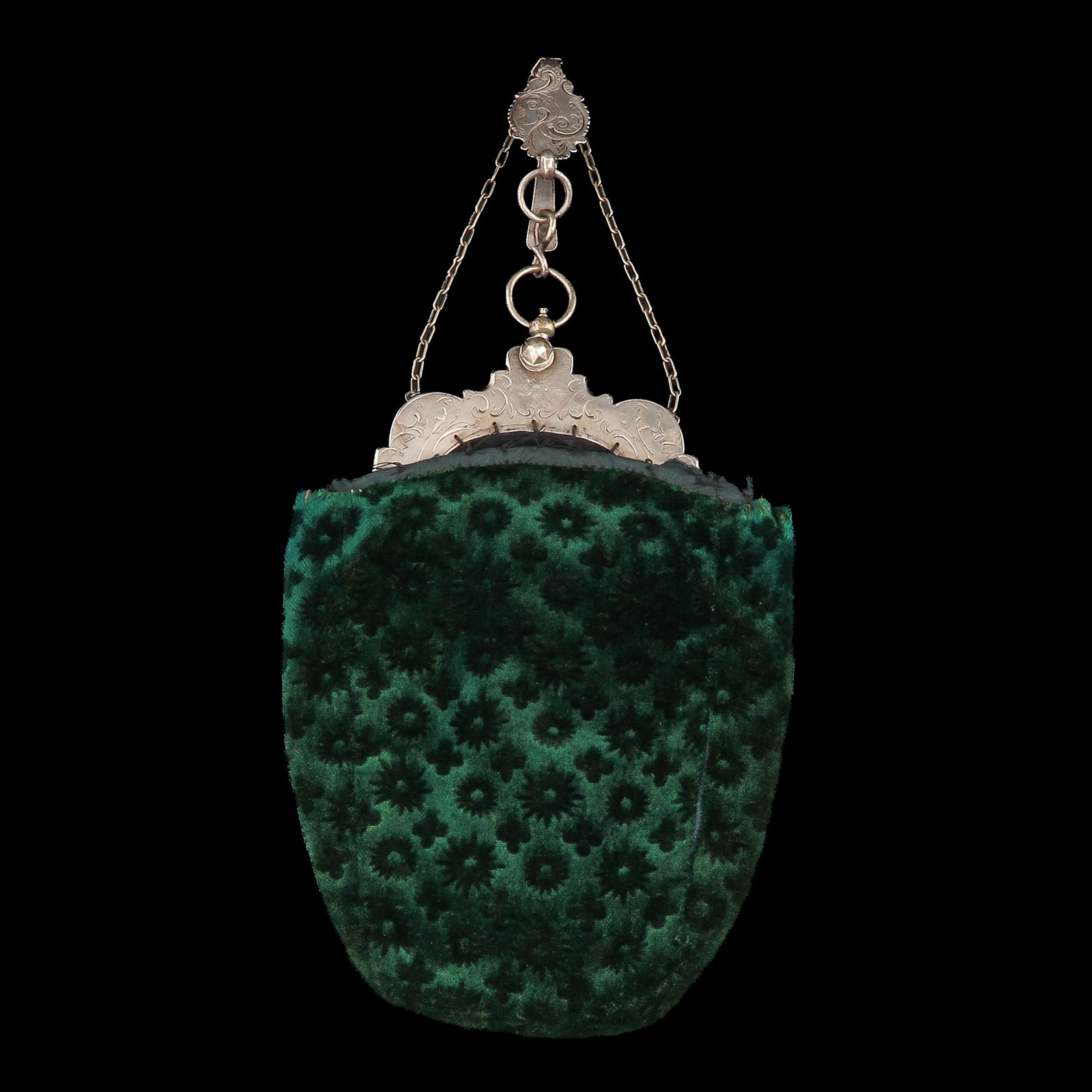 A Purse with Silver Frame: with an engraved silver frame, decorated with floral motifs and parrots, with hook, width 19 cm.