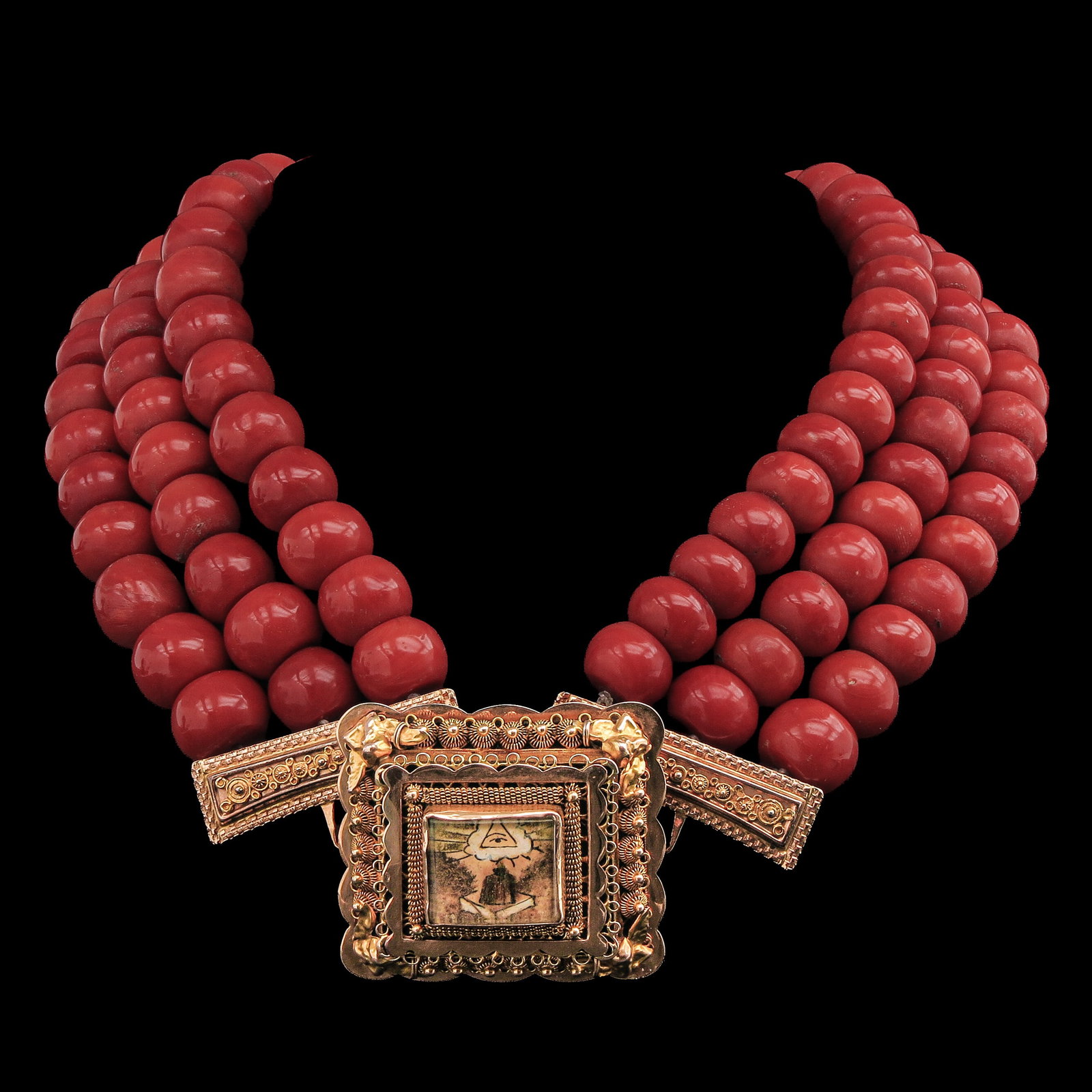 A Red Coral Necklace: 3 rows red coral, with 14 Krt gold Volendam clasp, deep red in colour, diameter beads 13 - 14 mm., weight 316 grams