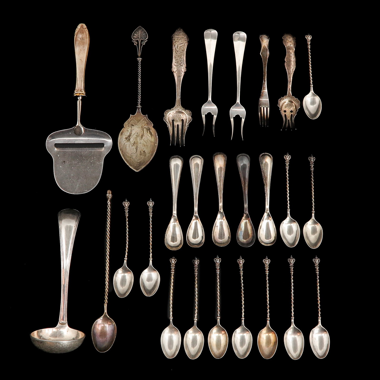 A Collection of Cutlery: consisting of various cutlery, including silver cheese slicer with silver handle, length 21 cm.