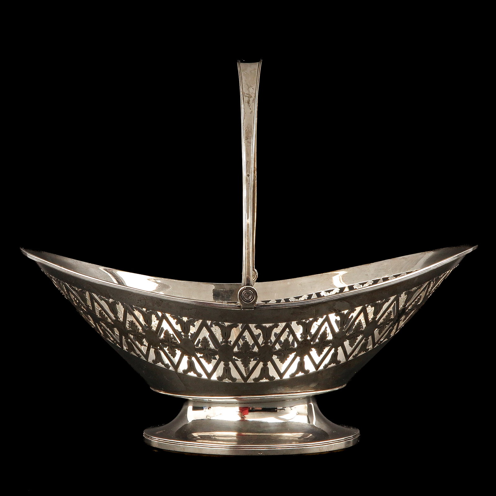 A Silver Handled Basket: silver, ca. 1810 The Hague, length 35 cm.