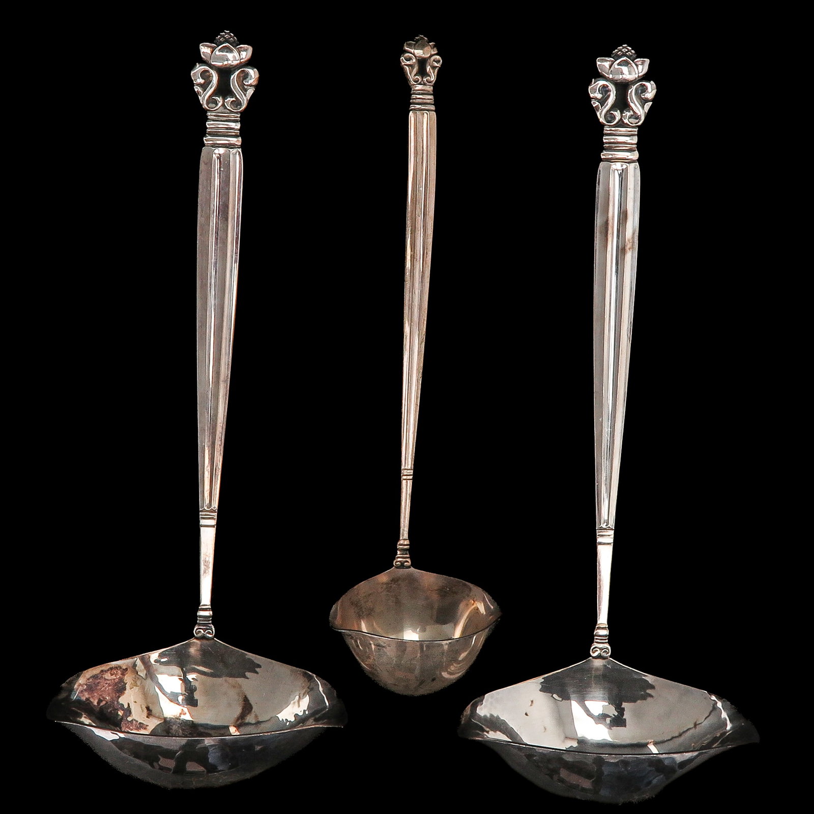 A Set of Georg Jensen Cutlery: consisting of 2 sauce spoons and 1 gravy spoon, sterling silver, Georg Jensen, model Acorn, designed by Johan Rohde, longest 20 cm.