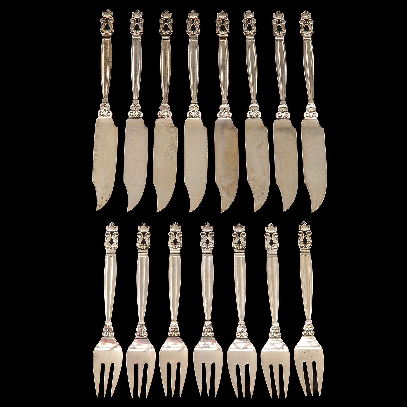 A Set of Georg Jensen Cutlery: of 8 fish knives and 7 fish forks, sterling silver, Georg Jensen, model Acorn, designed by Johan Rohde, longest 20 cm.