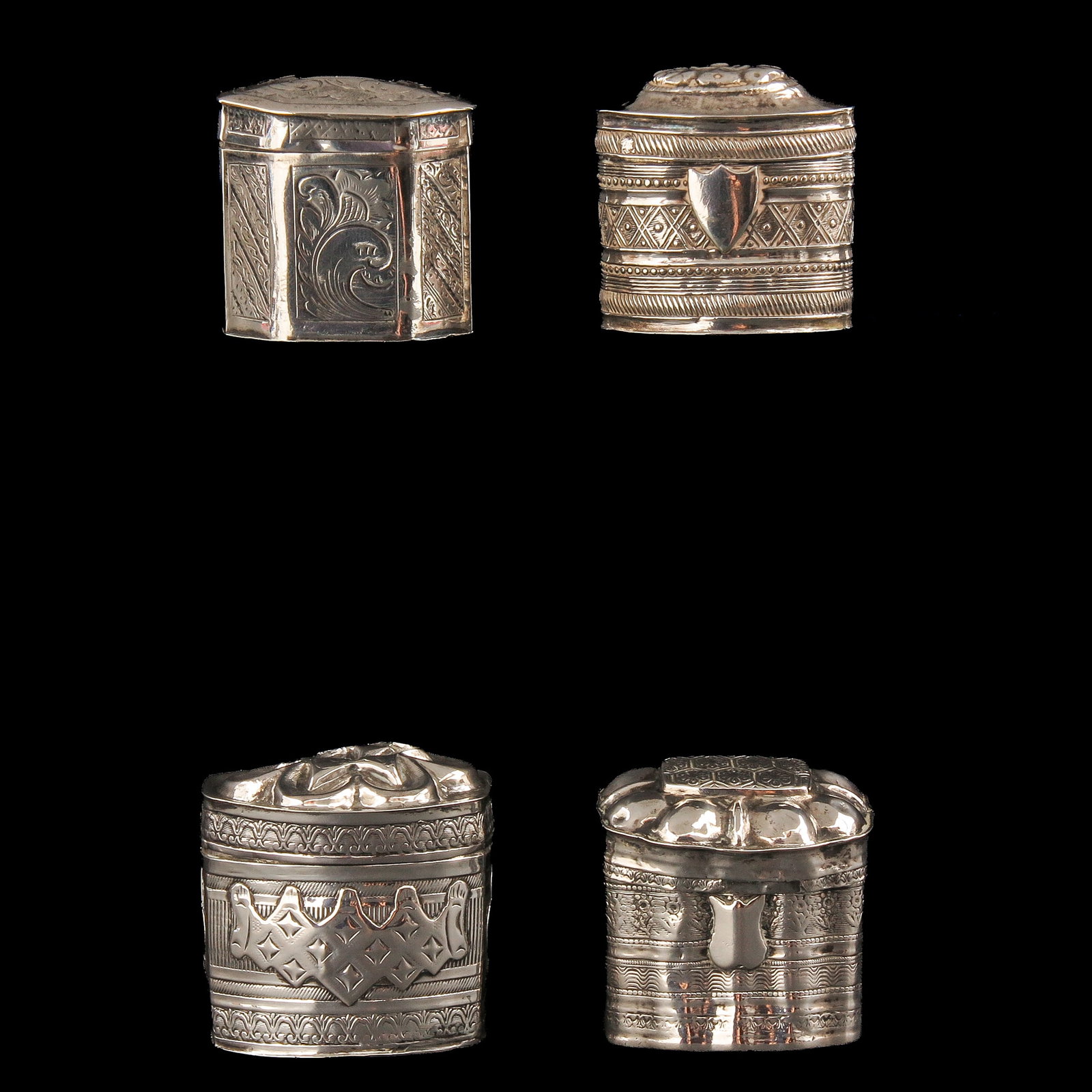 A Collection of Loderein Boxes: consisting of 4 silver loderein boxes, tallest 4 cm.