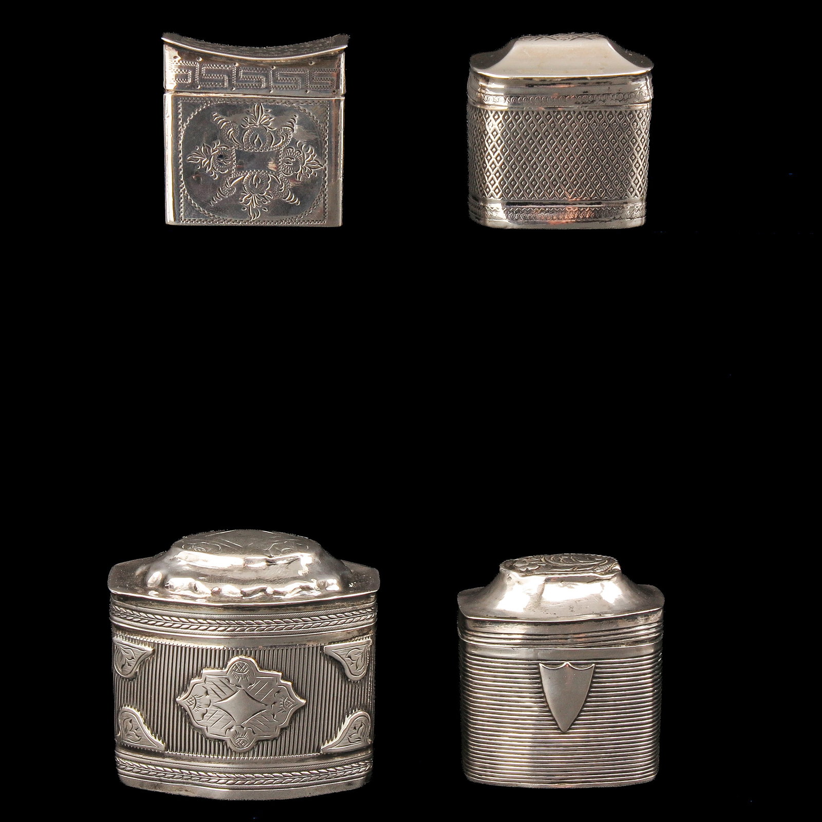 A Collection of Loderein Boxes: consisting of 4 silver loderein boxes, tallest 4 cm.