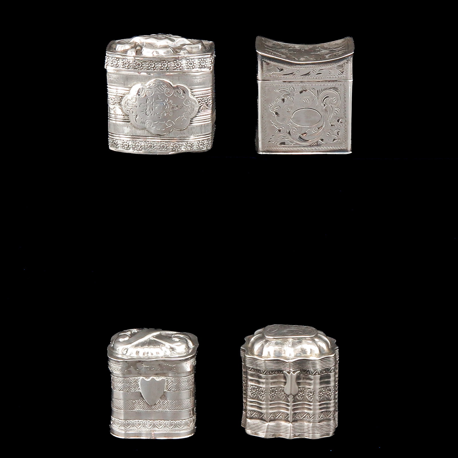 A Collection of Loderein Boxes: consisting of 4 silver loderein boxes, tallest 4 cm.