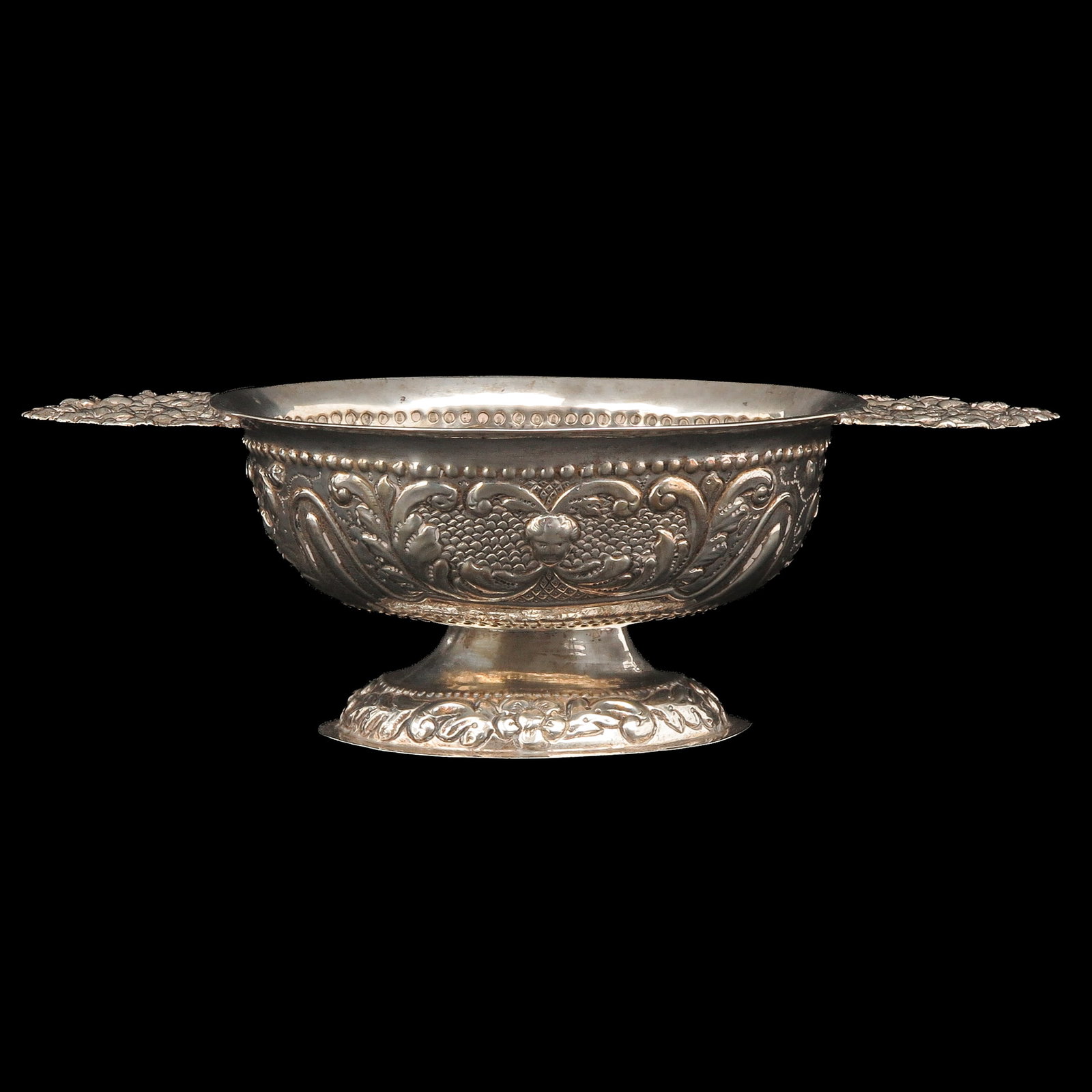A Silver Brandy Bowl: silver, with floral decoration, width 25 cm. including handles