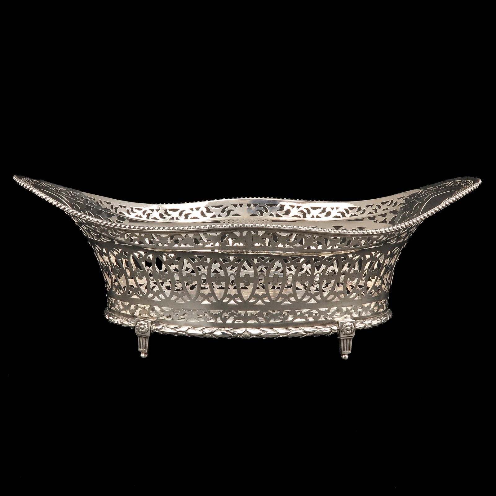 A Silver Bread Basket: silver, 18th century, with pierced floral decoration, Cornelis Knuystingh, Rotterdam, 1792, active from 1780 - 1811, length 40 cm.