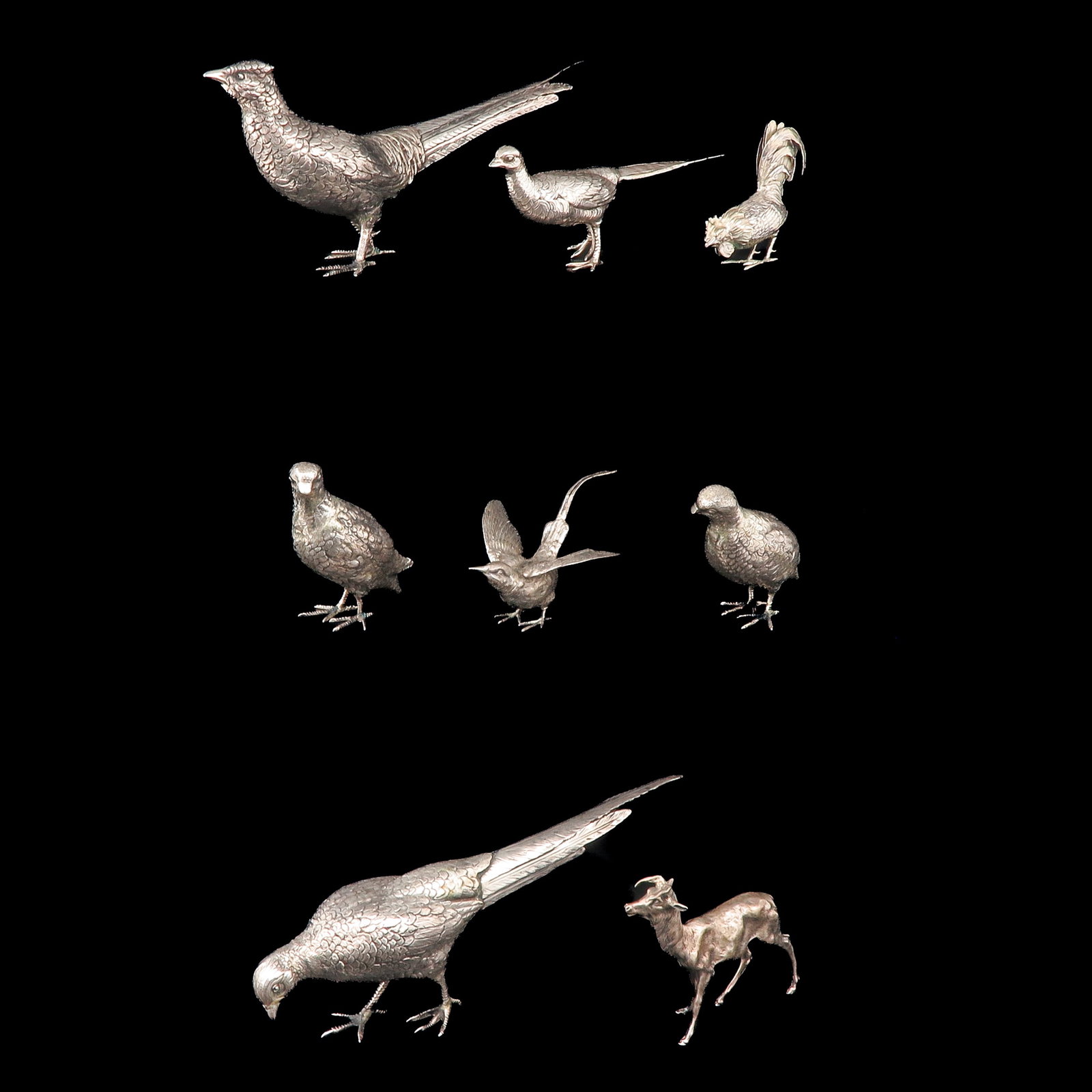 A Diverse Lot: consisting of a collection of various animal figures, including pheasants and other birds, including silver, largest 31 cm.