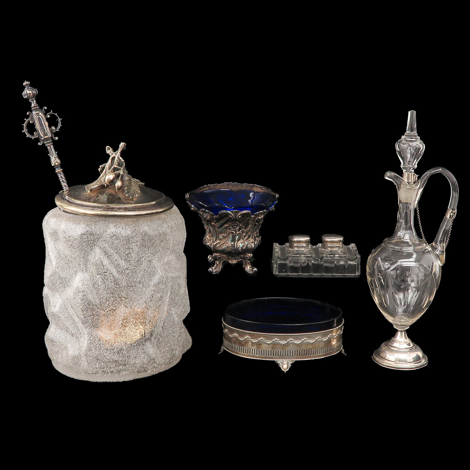 A Group of Galss and Crystal Objects: consisting of various glass and crystal objects, including silver mounts, tallest 38 cm.