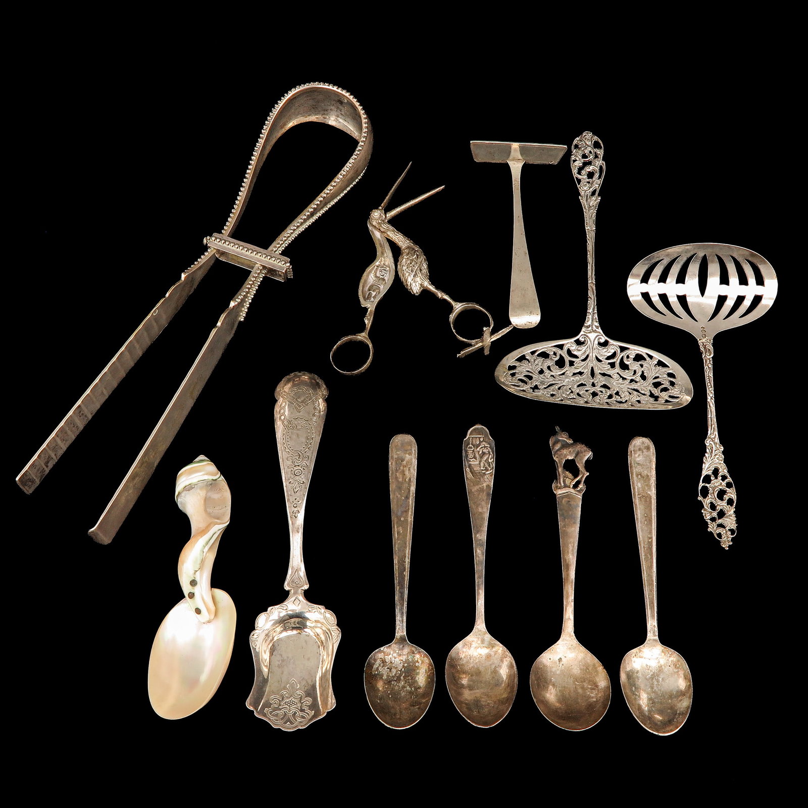 A Collection of Utensils and Cutlery: serving utensils and cutlery, including silver, longest 25 cm.