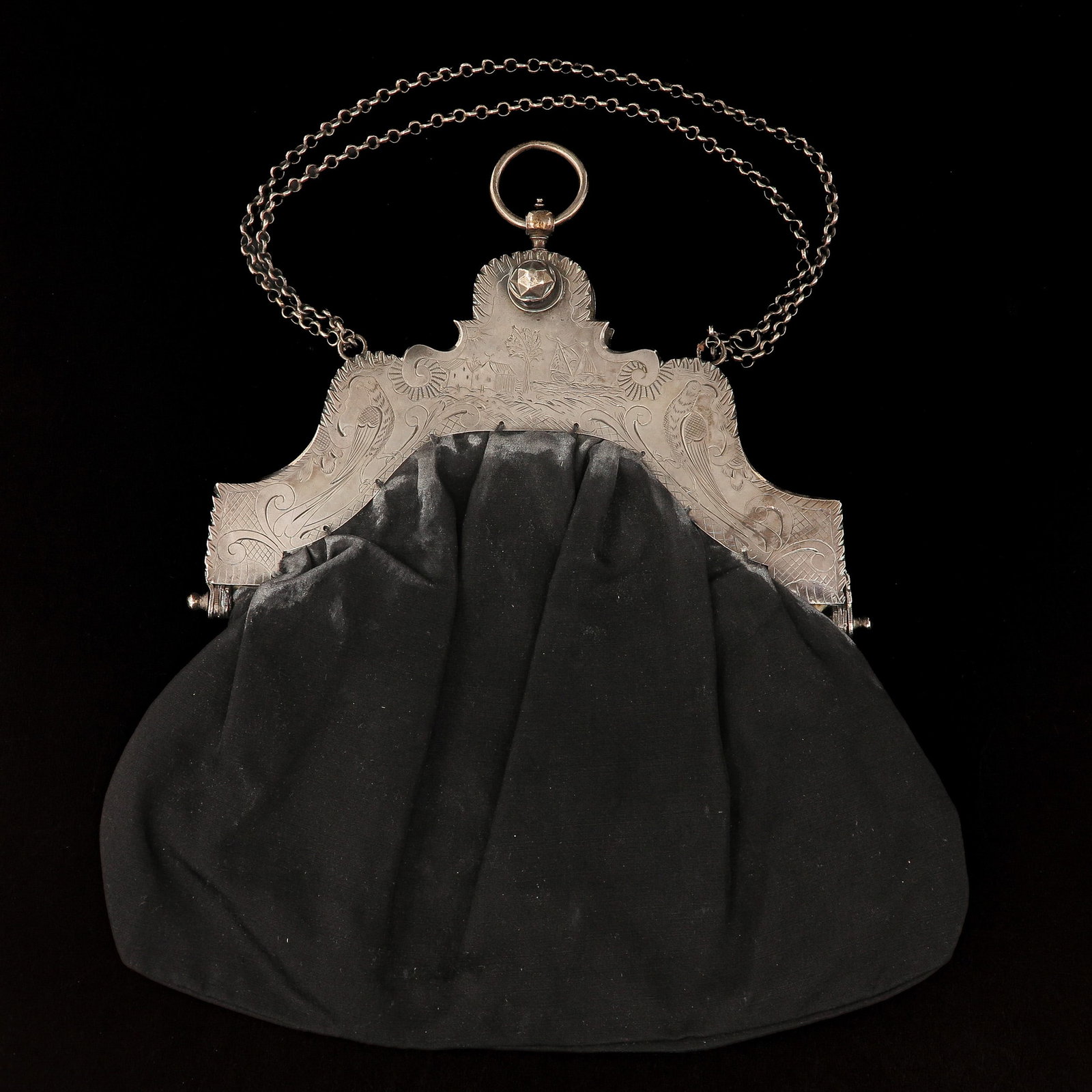 A Purse with a Silver Frame: Middelburg, hallmarked Jan Oranje 1826, with an engraved depiction of a landscape, width 21 cm.