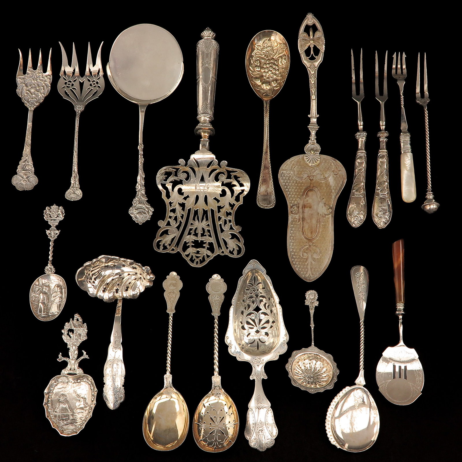A Group of Diverse items: consisting of a varied collection of table necessities, including silver