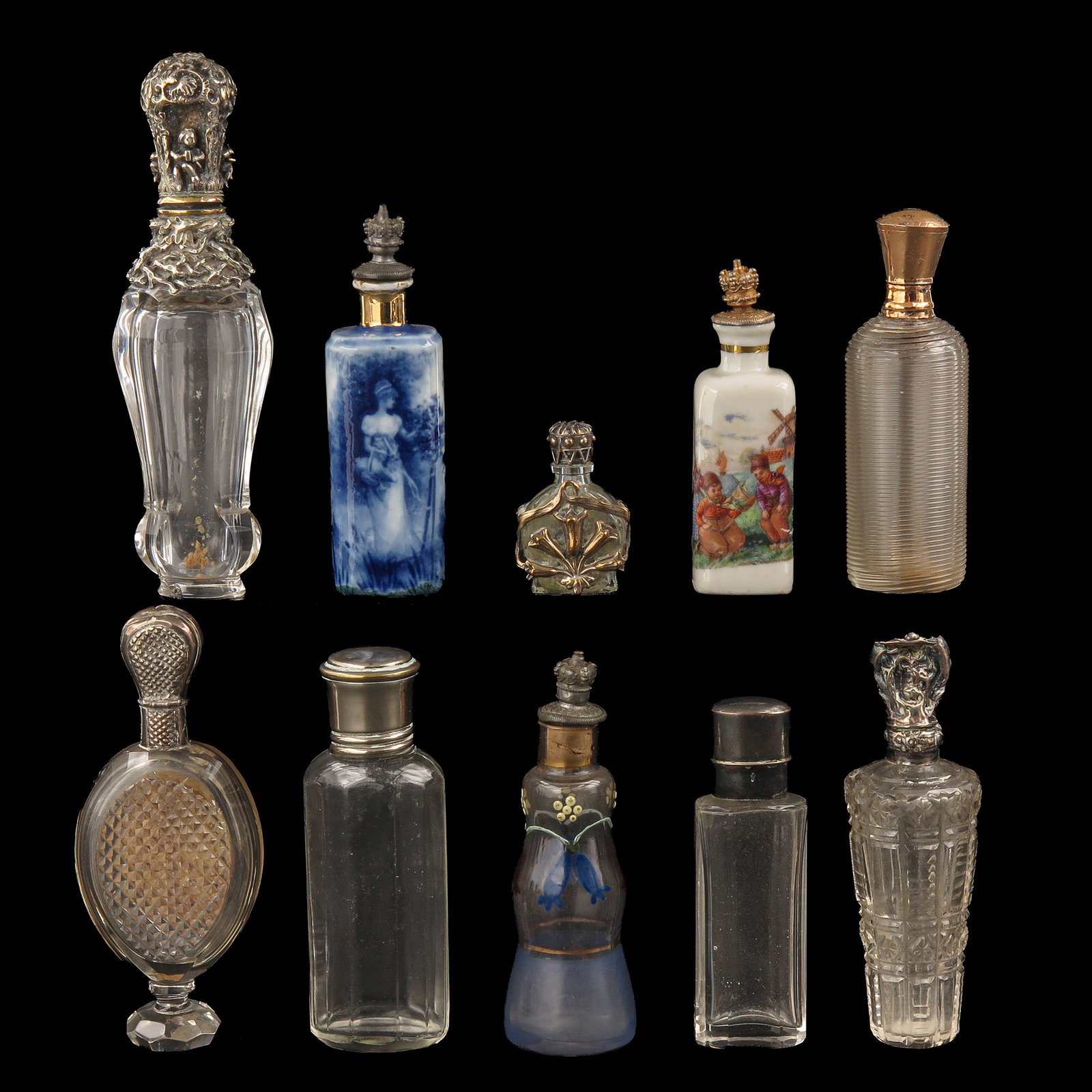 A Collection of Perfume Bottles: consisting of a collection of perfume bottles, including with silver and gold mounts, height 13 cm.