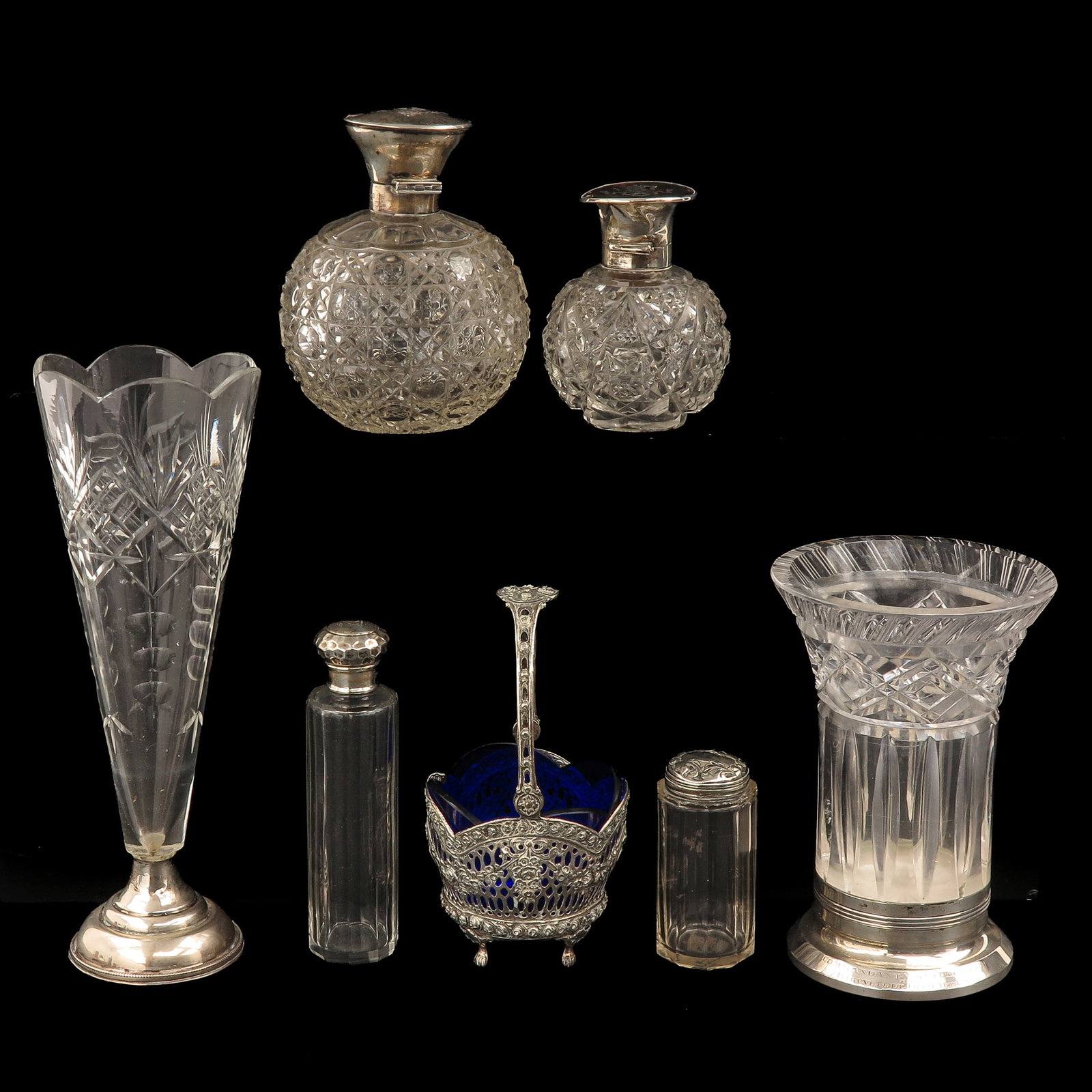 A Collection of Glass and Crystal: consisting of a collection of crystal and glass, including with silver mounts, tallest 24 cm.