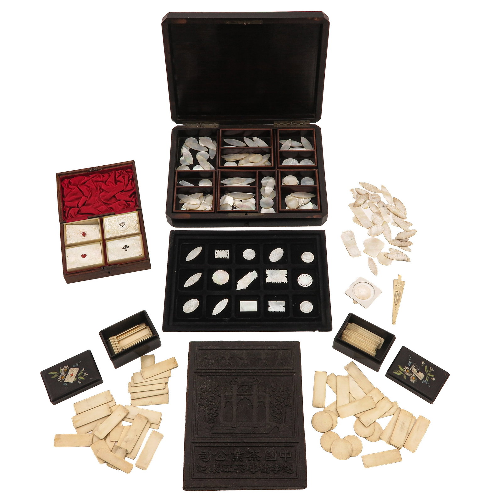 A Collection of Chinese Gaming Objects: Including mother of pearl counters, card suit markers, and fitted storage boxes.