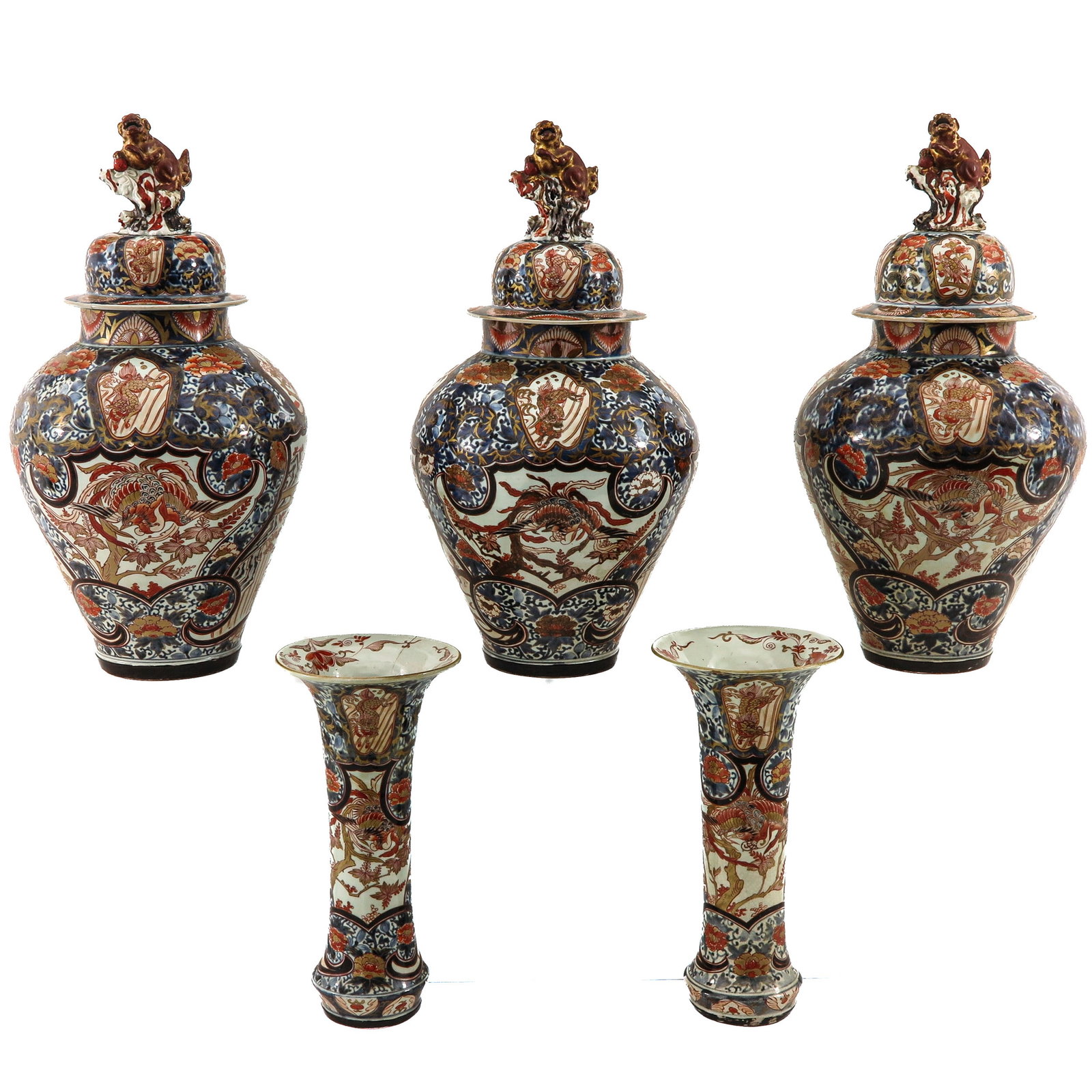 A Large 5 Piece Imari Garniture Set: Full floral decor, in iron red, blue and gilt enamels, tallest vase is 60 cm., in diverse conditions.