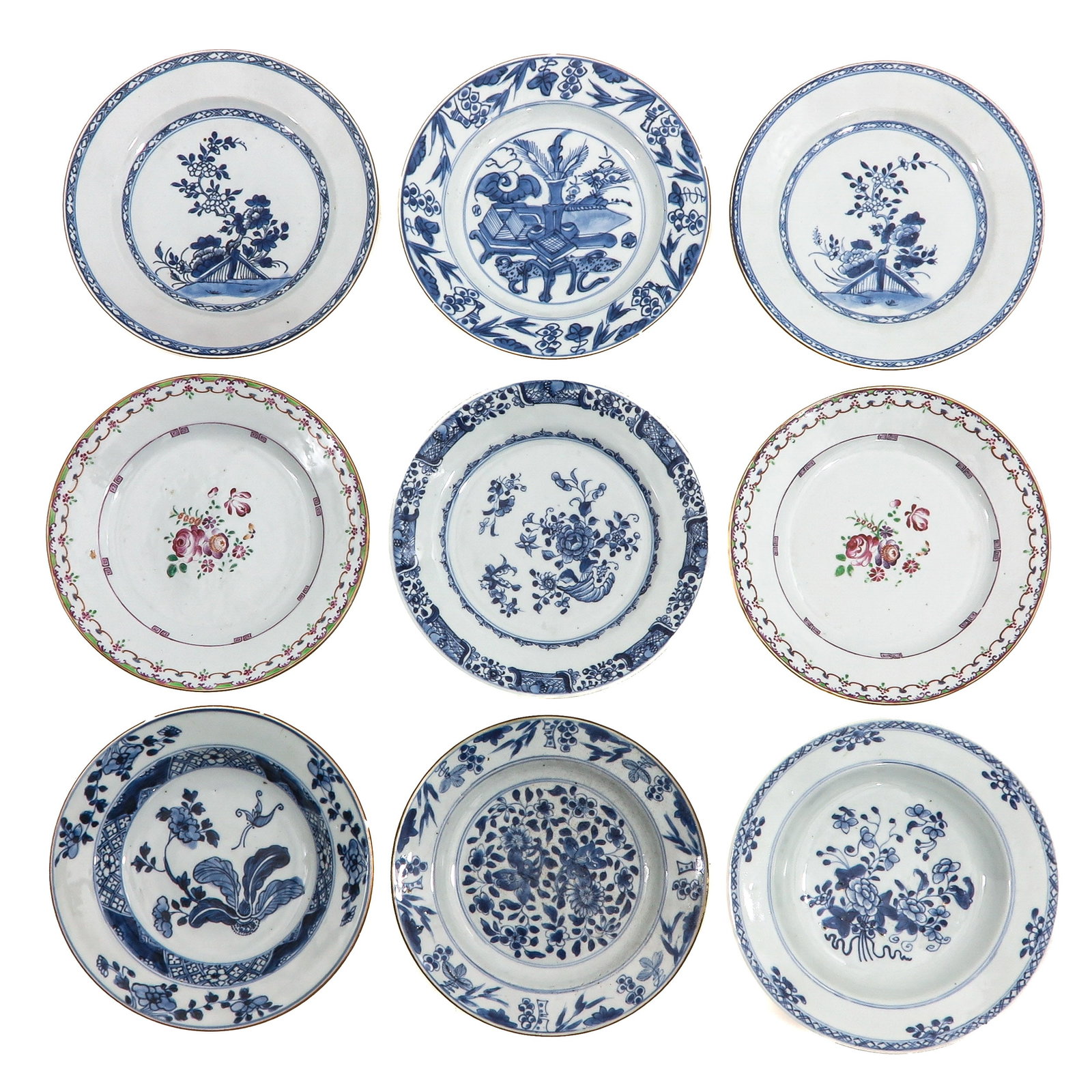 A Collection of 9 Plates: In a variety of decors, 18th Century 24 cm. in diameter, chip and hairline.