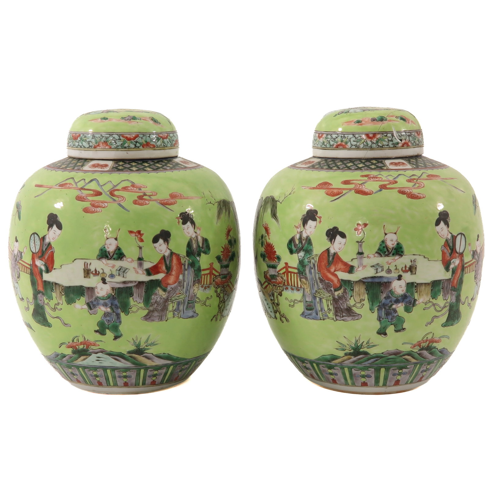 A Pair of Ginger Jars: Light green ground decorated with Chinese figures in a garden setting, 19th century, 30 cm. tall, 1 cover restored.