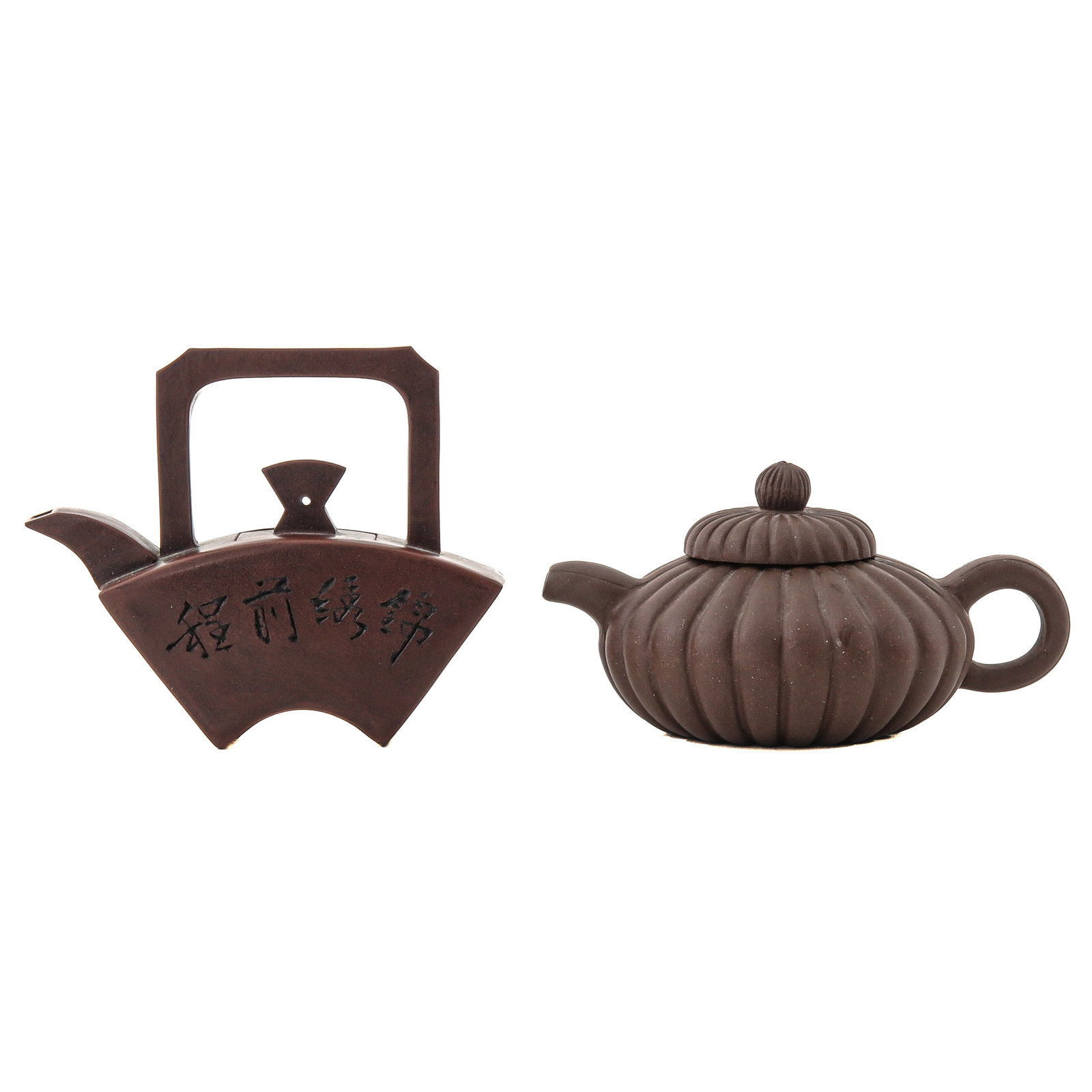A Lot of 2 Yixing Teapots: Including a fan shaped teapot with calligraphic decoration and a pumpkin shape, tallest is 9 cm.