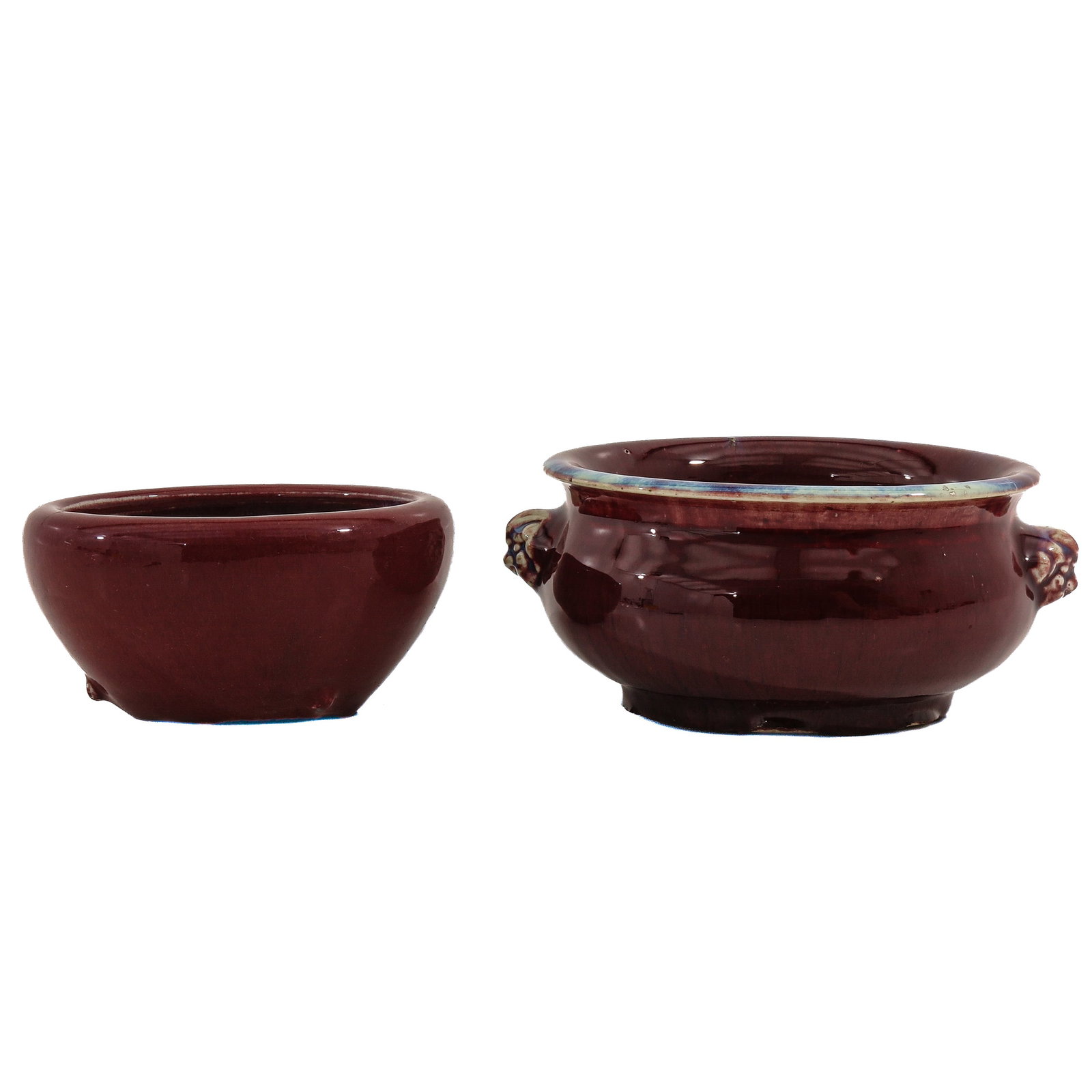 A Lot of 2 Oxblood Red Glaze Censers: including 1 with lion mask handles, largest is 21 cm. in diameter.