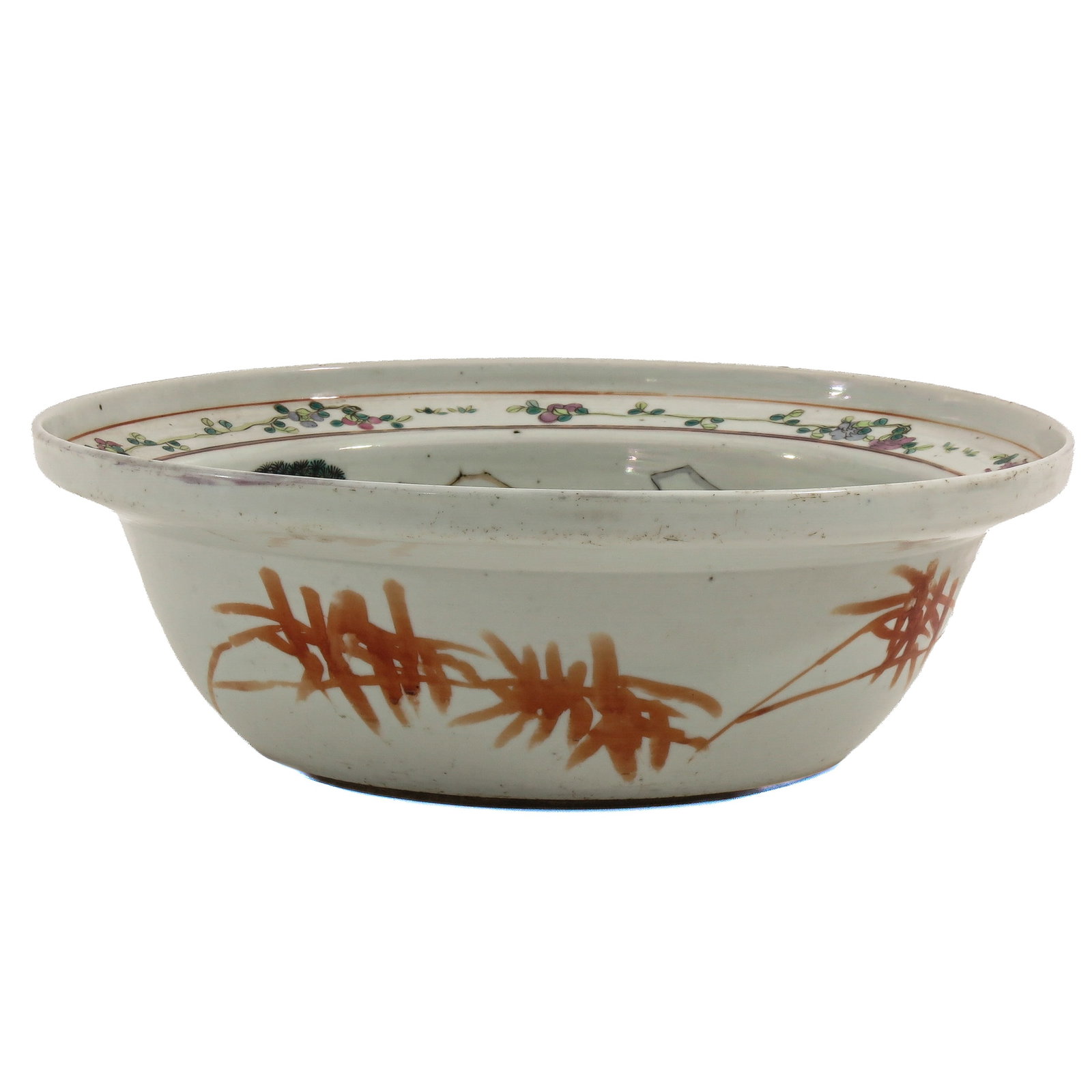 A Famille Rose Wash Basin: Interior is decorated with a landscape scene with bamboo motifs on the exterior, 19th Century, 28 cm. in diameter.