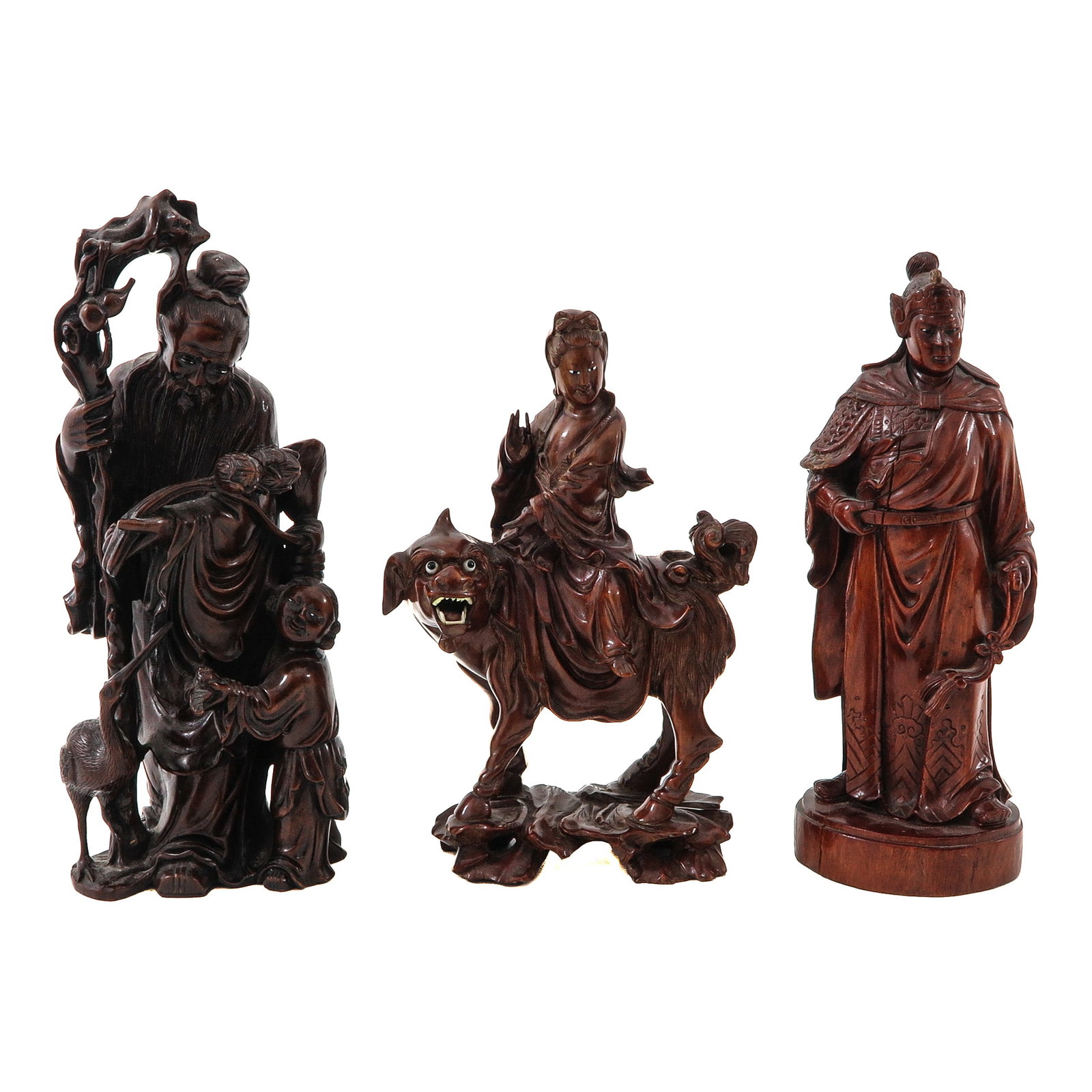 A Collection of 3 Chinese Carved Wooden Figures: Depicting an immortal, a female deity seated on a mythical beast and a warrior, tallest is 25 cm.