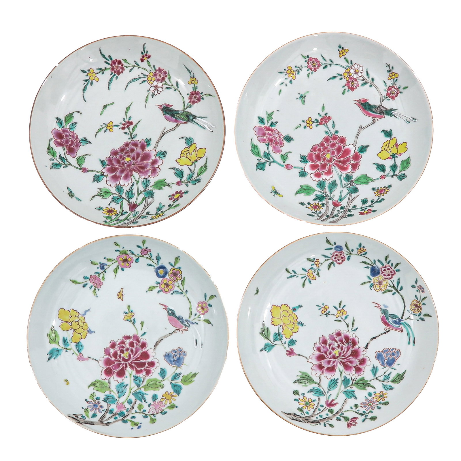 A Group of 4 Famille Rose Plates: Depicting a scene with flowers and birds, Yongzheng Period, largest plate is 22 cm. in diameter, chip and hairline.