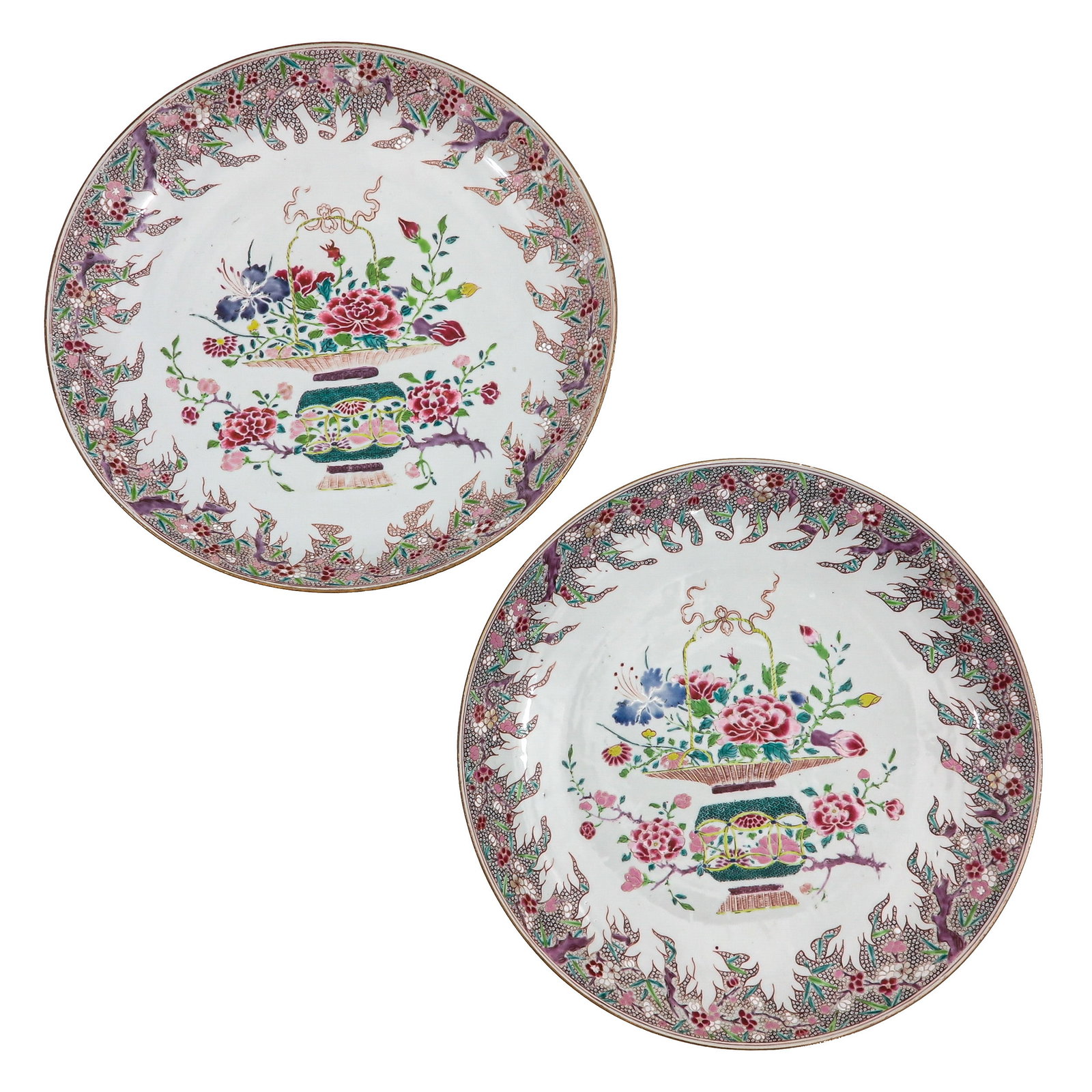 A Pair of 2 Famille Rose Chargers: Decorated with baskets of flowers and floral motifs, 18th Century, 42 cm. in diameter.