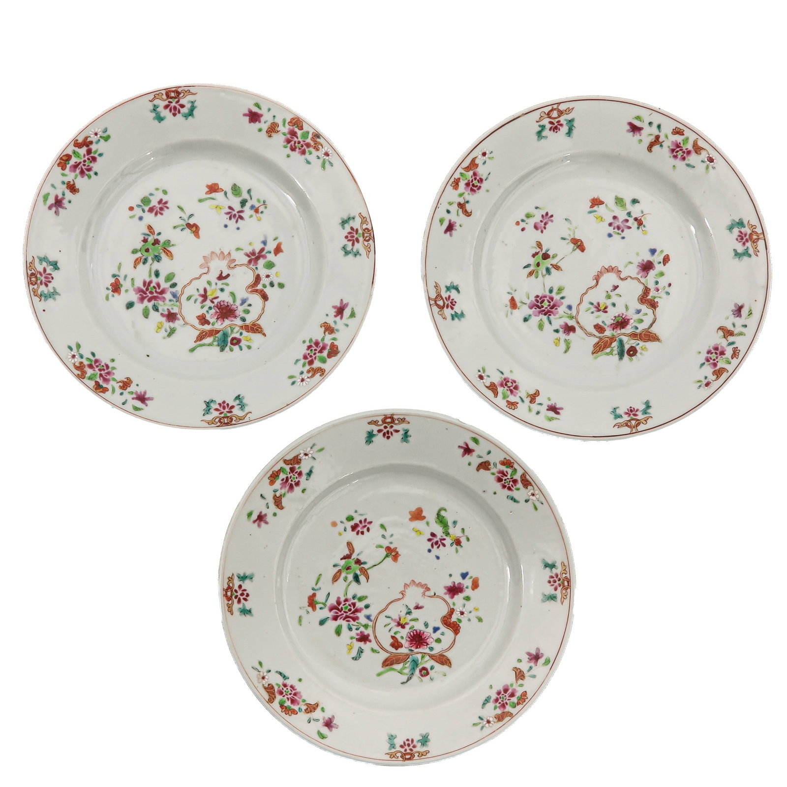 A Series of 3 Famille Rose Plates: Decorated with floral sprays, 18th Century, 23 cm. in diameter, chip and hairline.