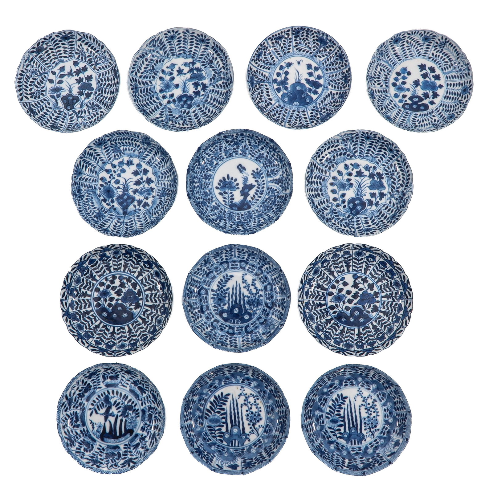 A Group of Blue and White Saucers: In a variety of blue and white decors, largest saucer is 13 cm. in diameter, in diverse conditions.