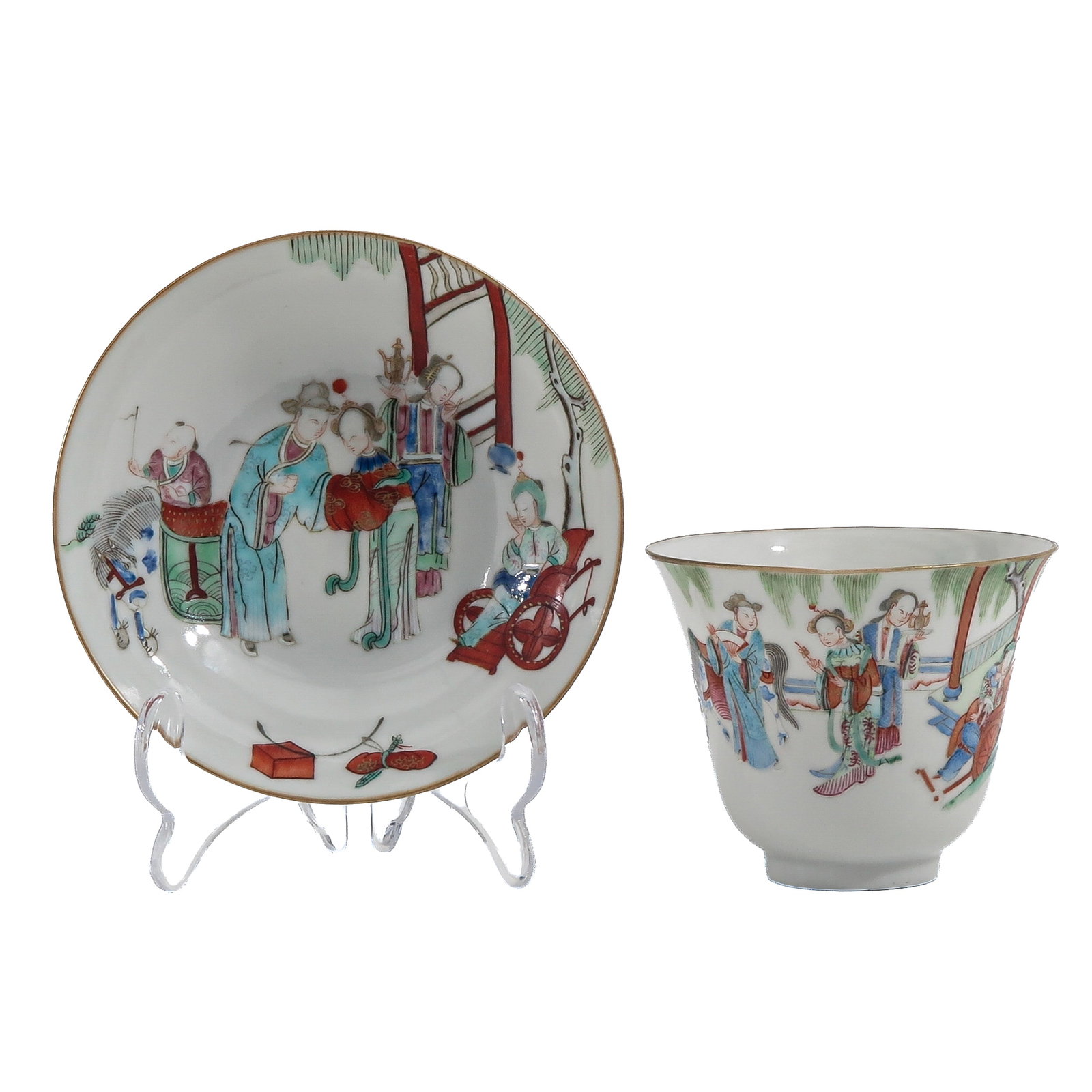 A Famille Rose Cup and Sauce: Decorated with a figural scene o ladies and children in a garden, 18th Century, saucers are 13 cm. in diameter.