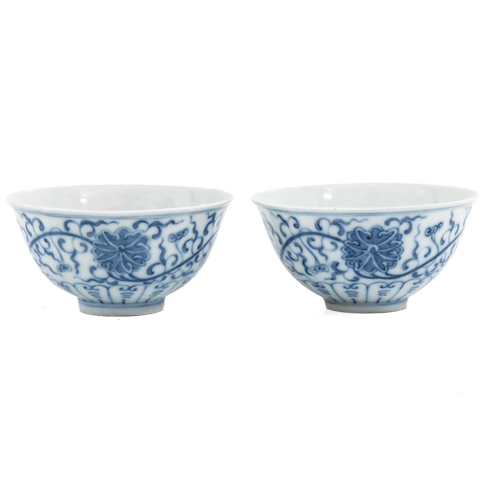 A Pair of Blue and White Cups: Scrolling floral decor, 9 cm. in diameter.