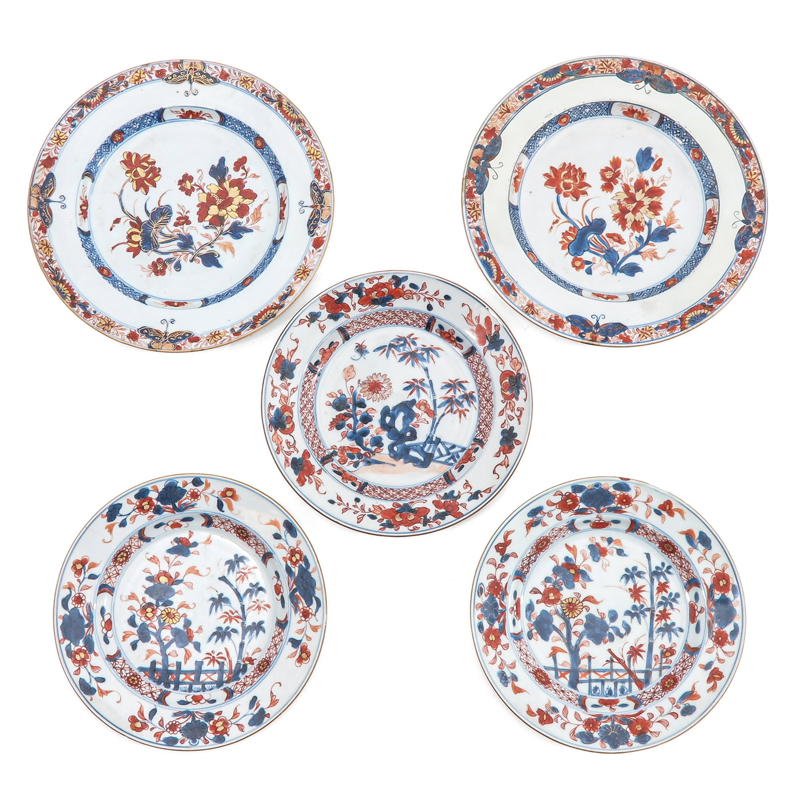 A Group of 5 Imari Plates: Decorated with floral sprays, butterflies and garden scenes, 18th Century, largest plate is 27 cm. in diameter, in diverse conditions.
