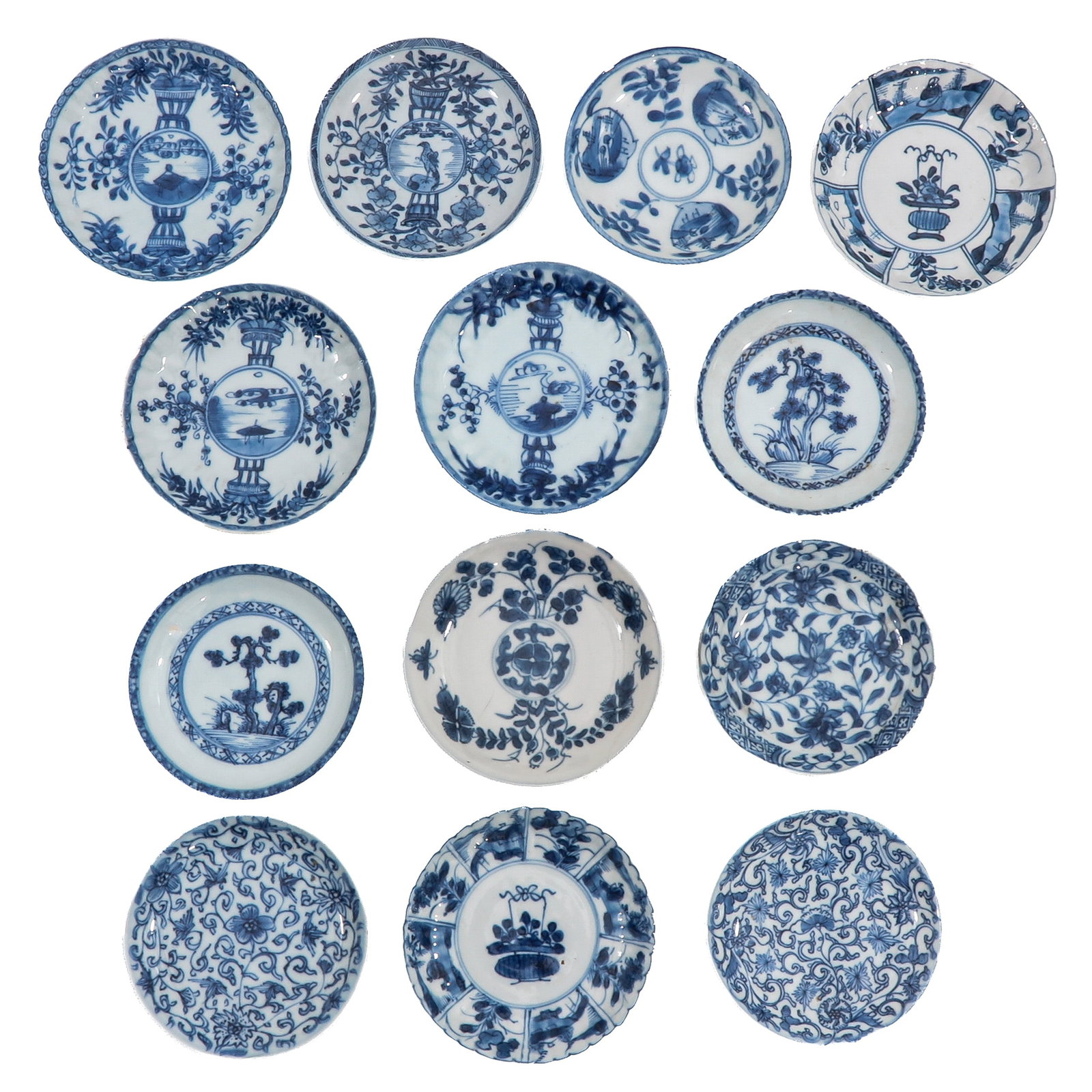 A Group of Blue and White Saucers: In a variety of blue and white decors, including 18th Century, largest saucer is 13 cm. in diameter, in diverse conditions.