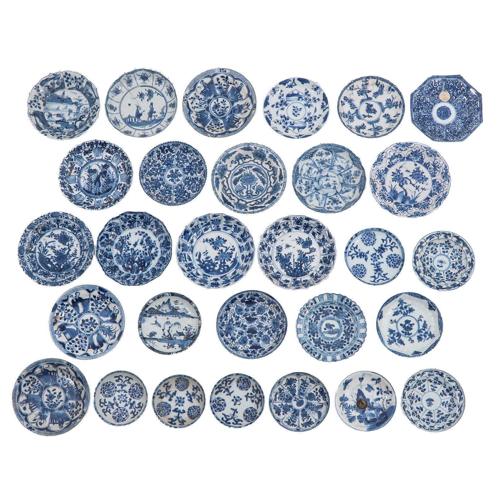 A Diverse Collection of Saucers: In a variety of blue and white decors, including 18th Century,largest saucer is 13 cm. in diameter, in diverse conditions.