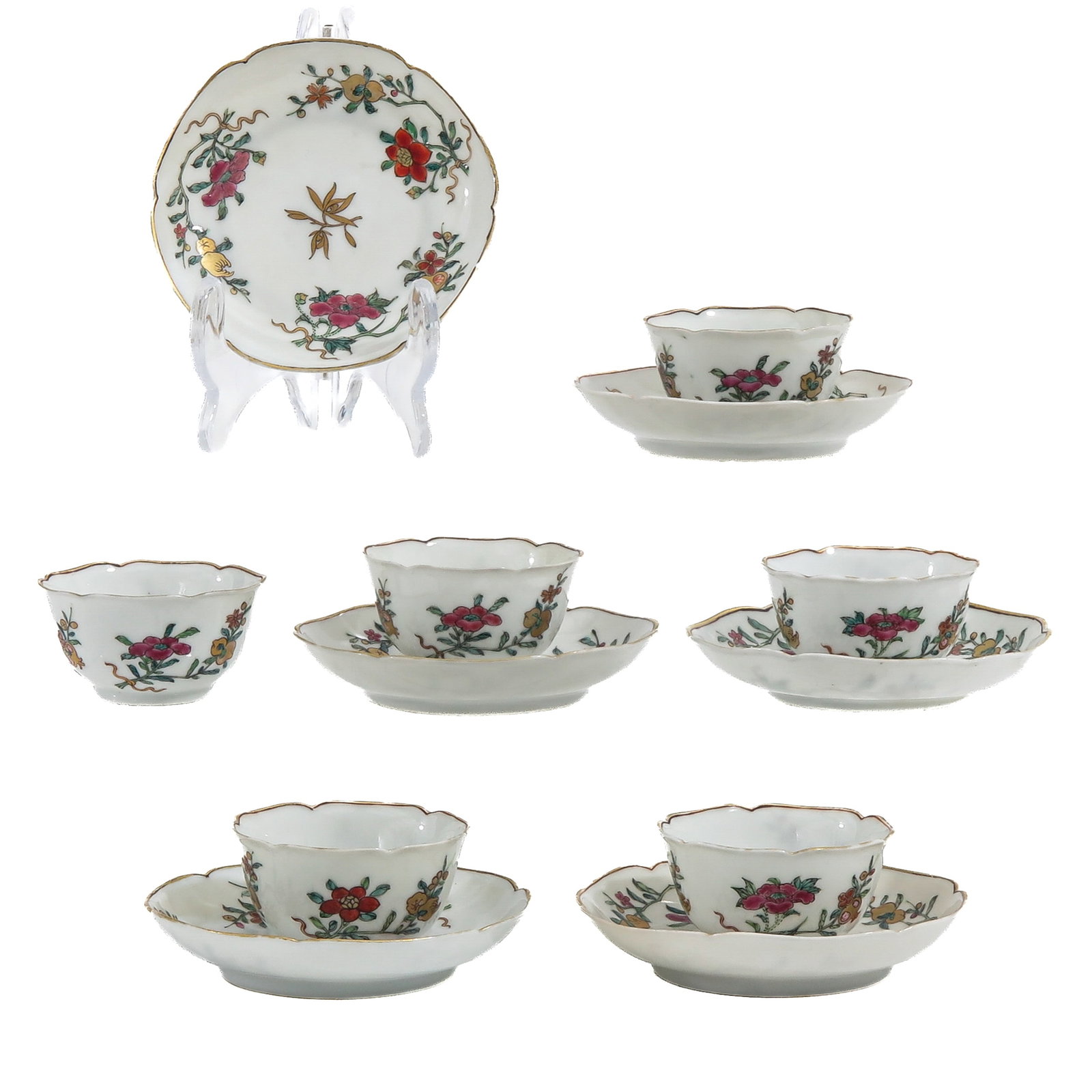 A Series of 6 Cups and Saucers: scrolling floral decor, Yongzheng Period, saucers are 9 cm. in diameter.